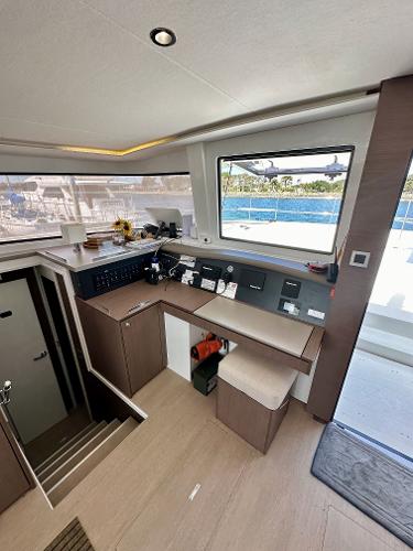 Modern interior of 2021 Bali 4.8 yacht with navigation station and sea view.