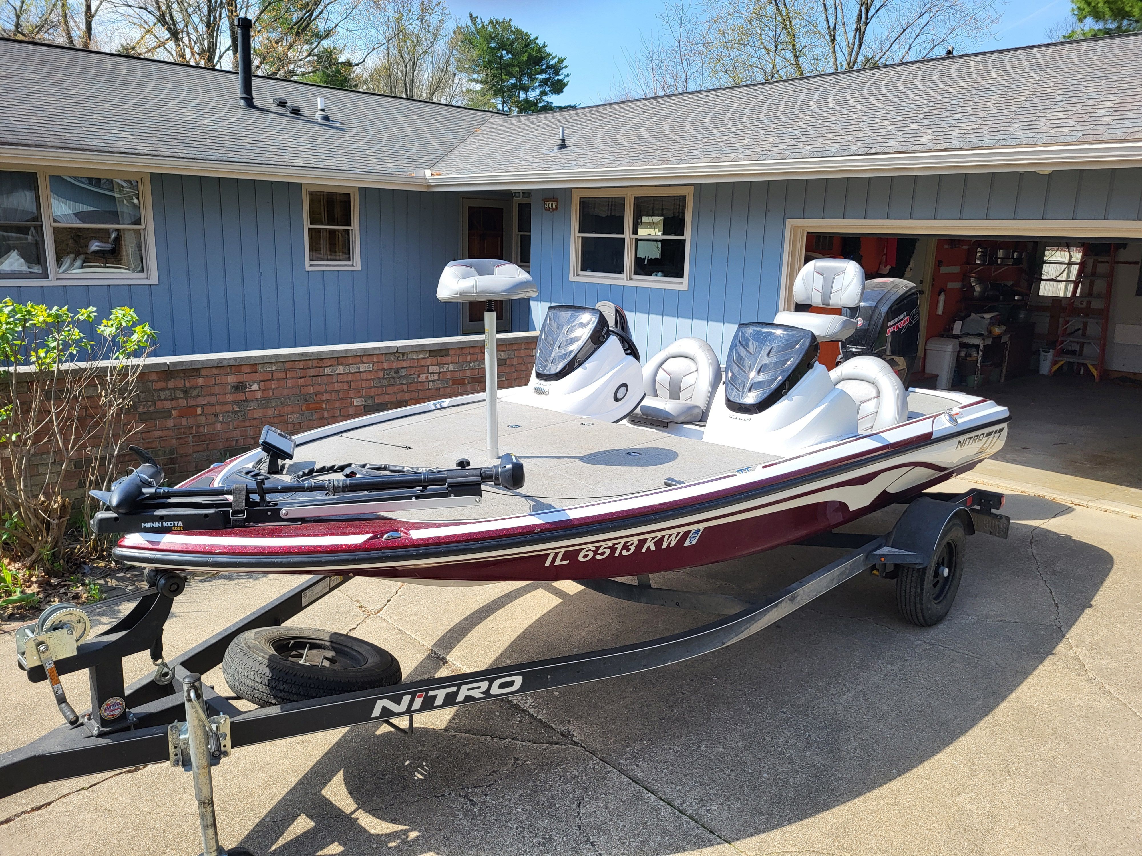 A 2017 Nitro Z17 boat on a trailer in a driveway.