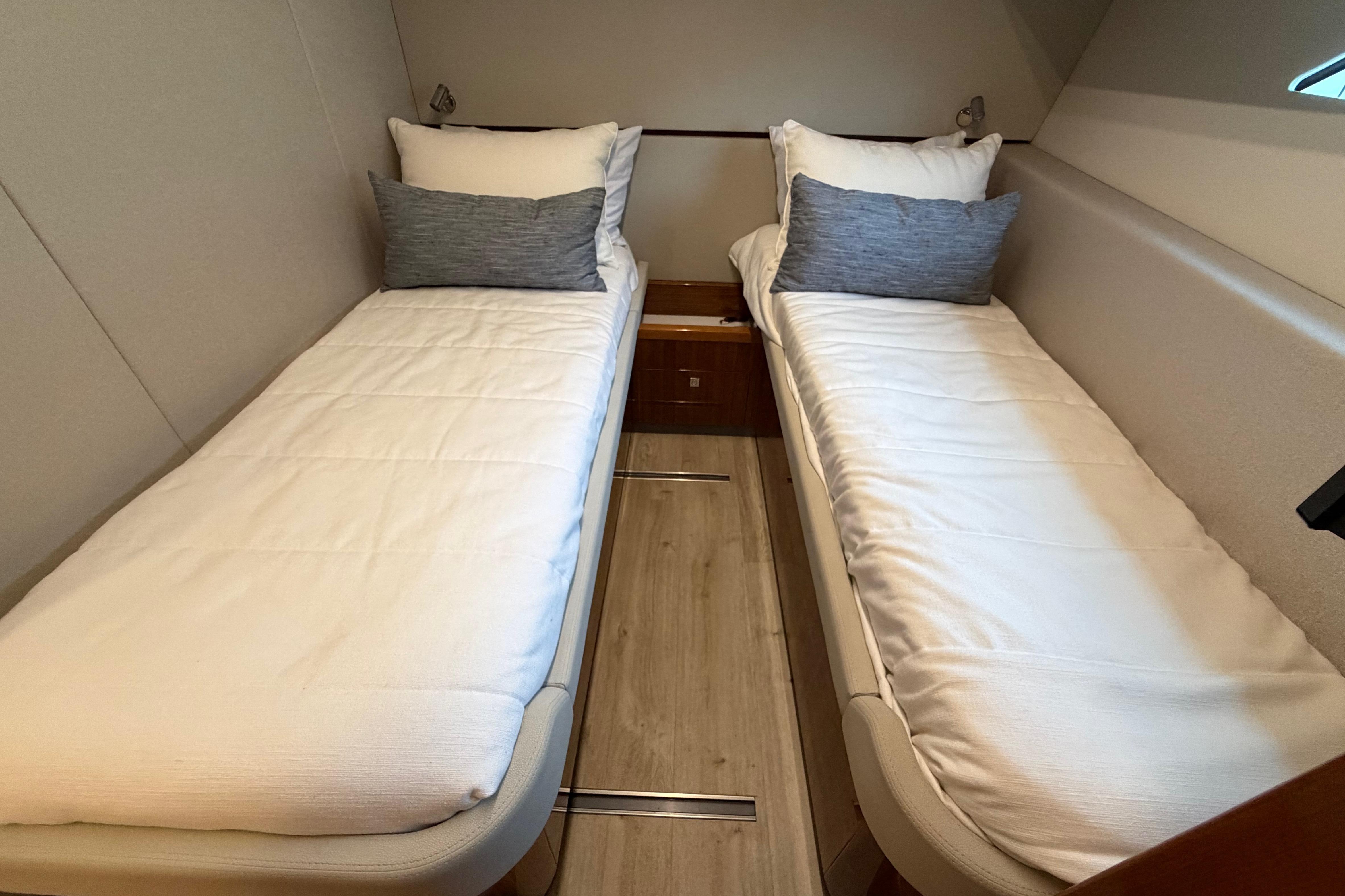 2023 Riviera 645 SUV cabin with twin beds and modern decor.