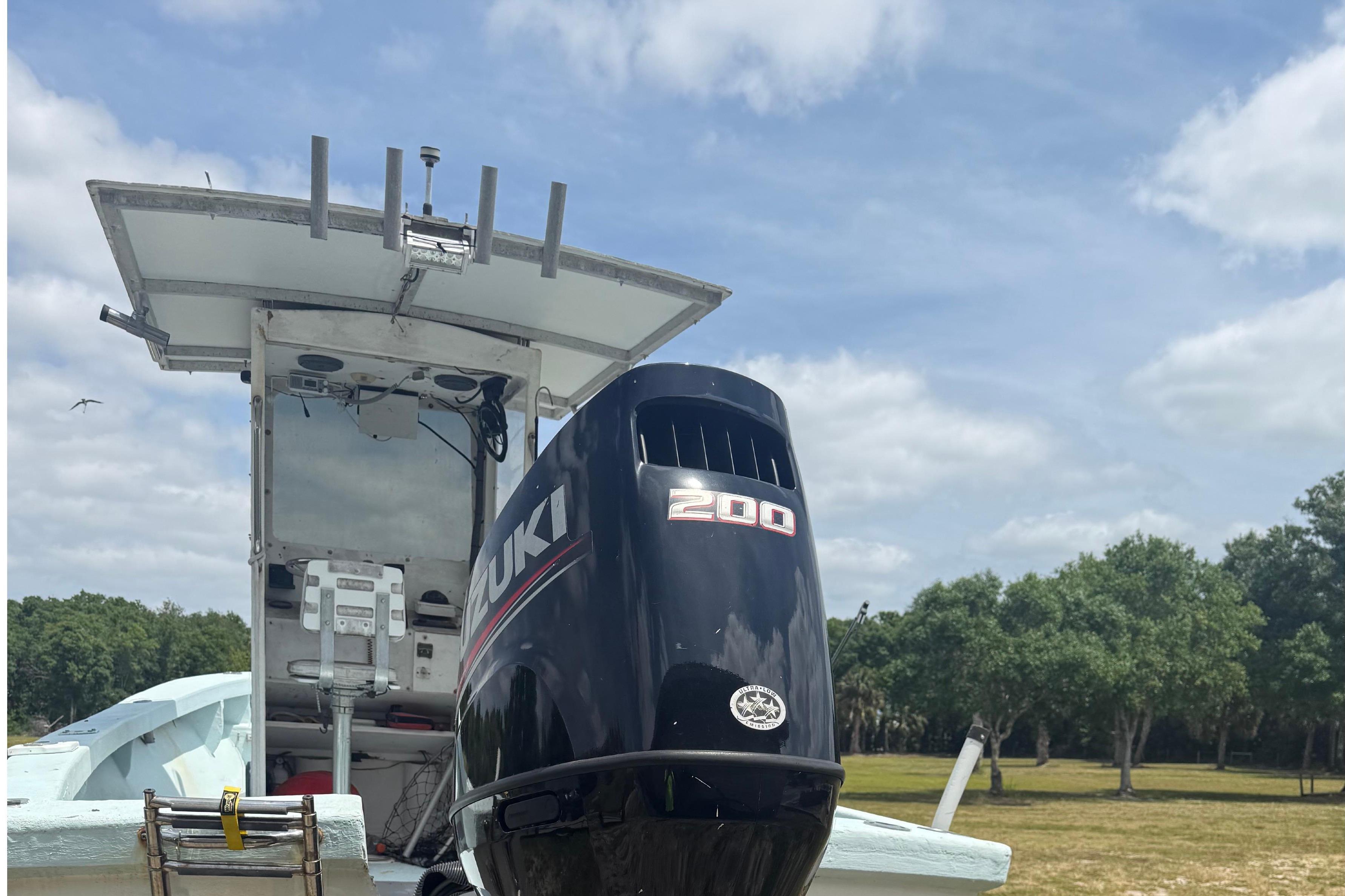 1956 Custom Mackerel boat with Suzuki 200 outboard motor.