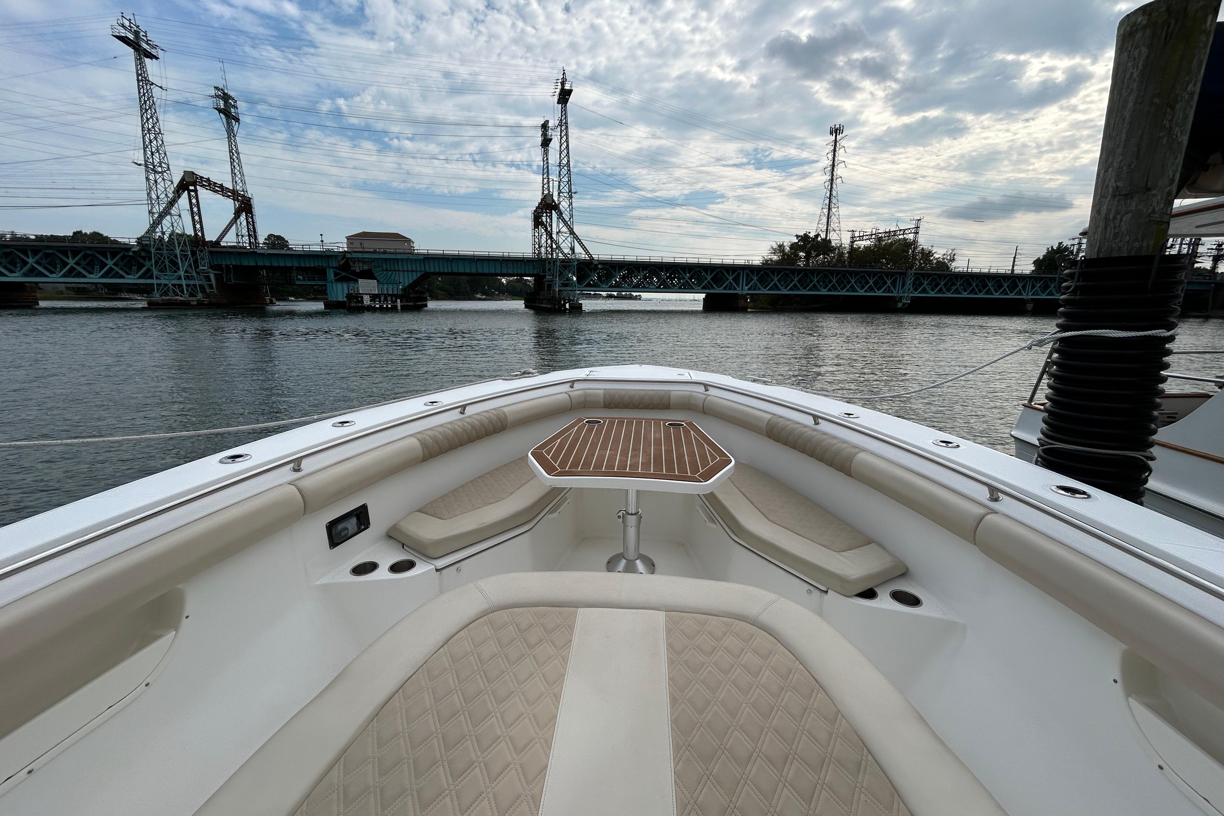 2017 Boston Whaler 370 Outrage boat interior with bridge view and cloudy sky.
