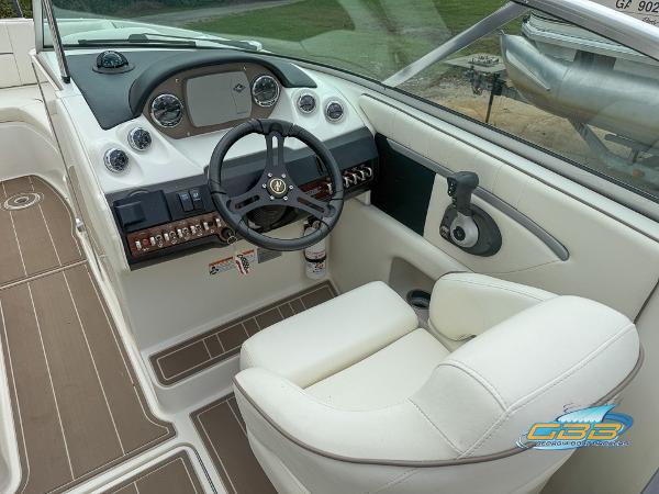 2008 Sea Ray 270 SLX boat cockpit with steering wheel and control panel.