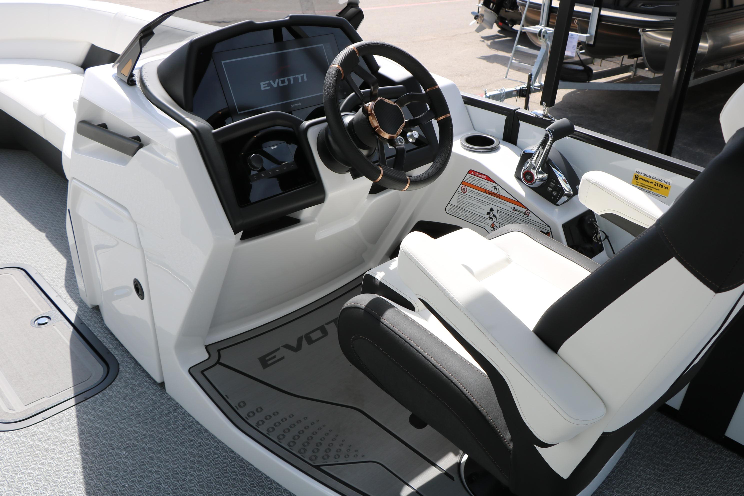 2026 Evotti 725 CS Tri-Toon boat cockpit with modern steering and controls.