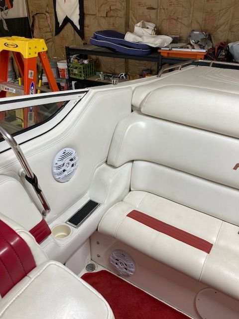 Interior of a 2001 Fountain Lightning boat with white leather seats.