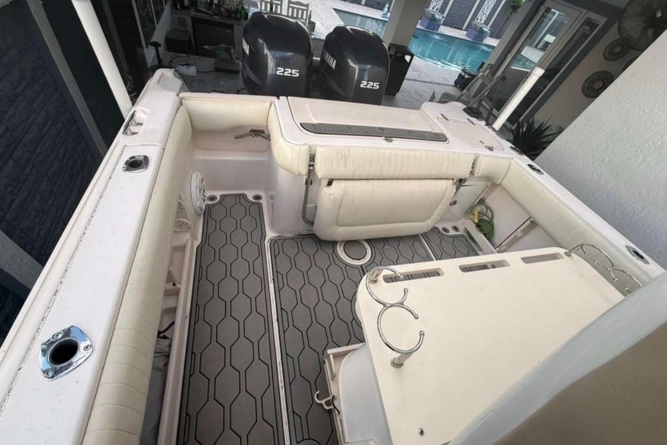 2004 Grady-White Chase 273 boat interior with twin 225 engines and spacious deck.