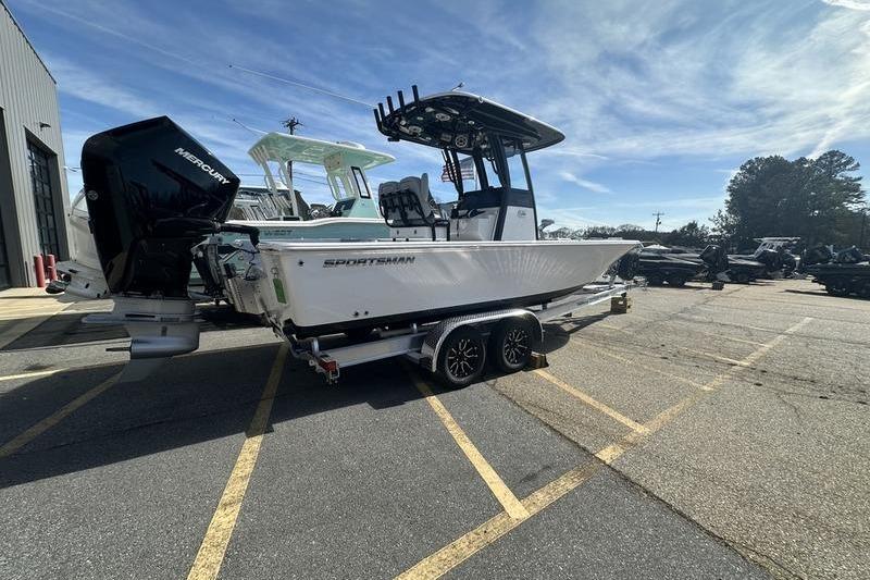2026 Sportsman Masters 247 Bay Boat on trailer, parked outdoors under clear sky.
