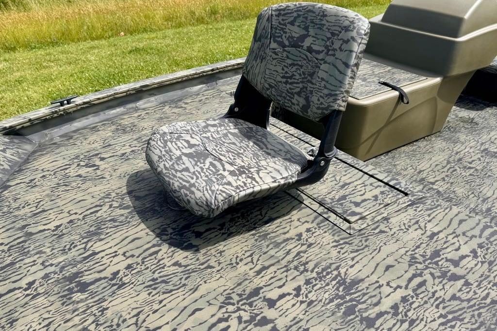 2026 Tracker Grizzly 1754 SC boat seat with camouflage pattern on deck.