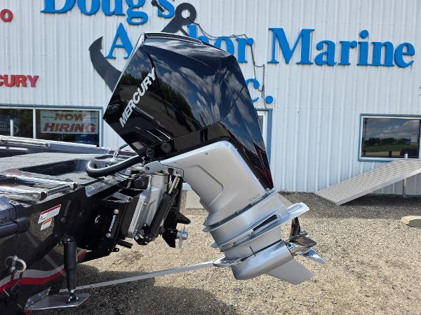 Outboard motor on a 2025 Nitro ZV-20 SPORT boat at a marine dealership.