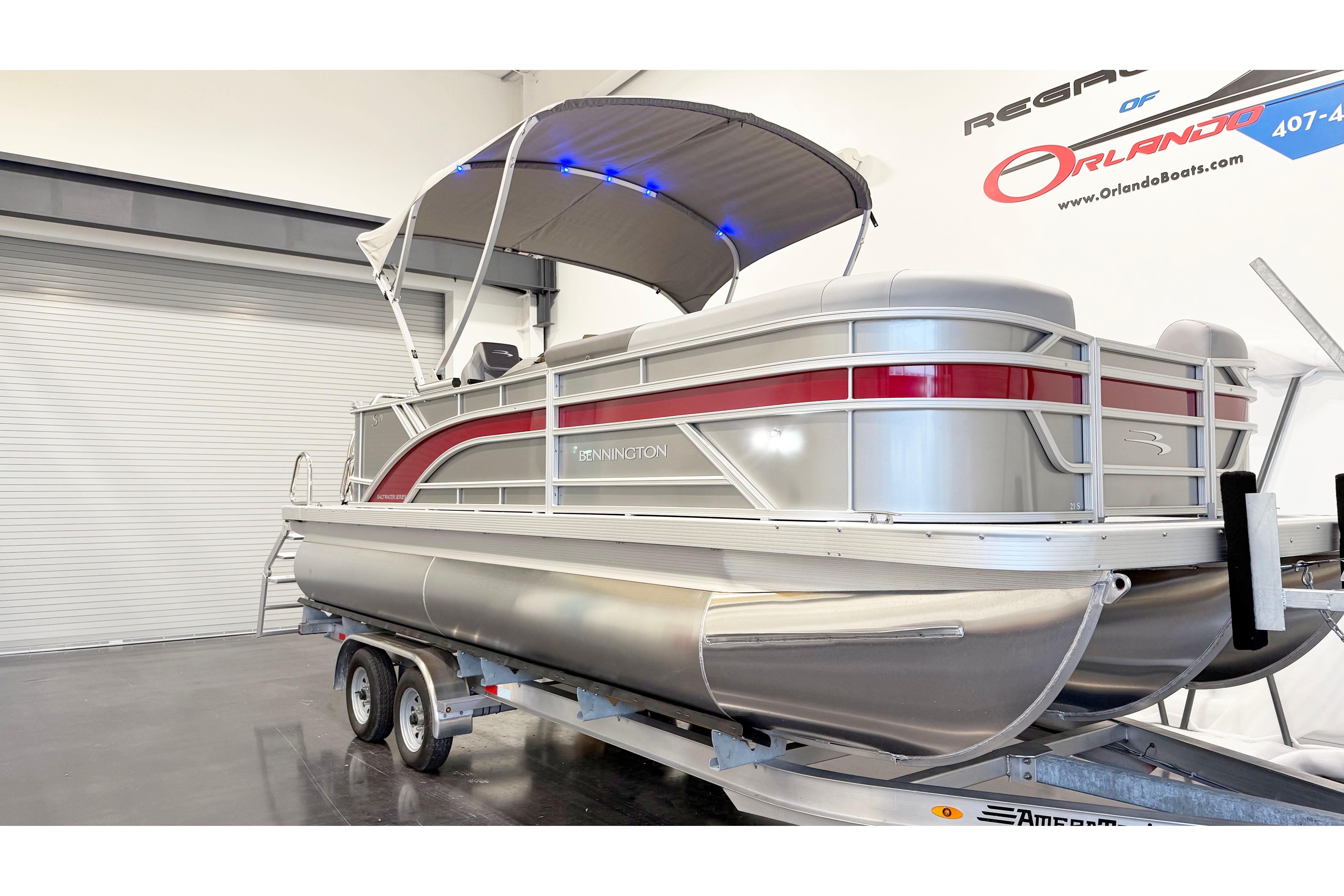 2025 Bennington 21S Cruise pontoon boat on trailer in showroom.