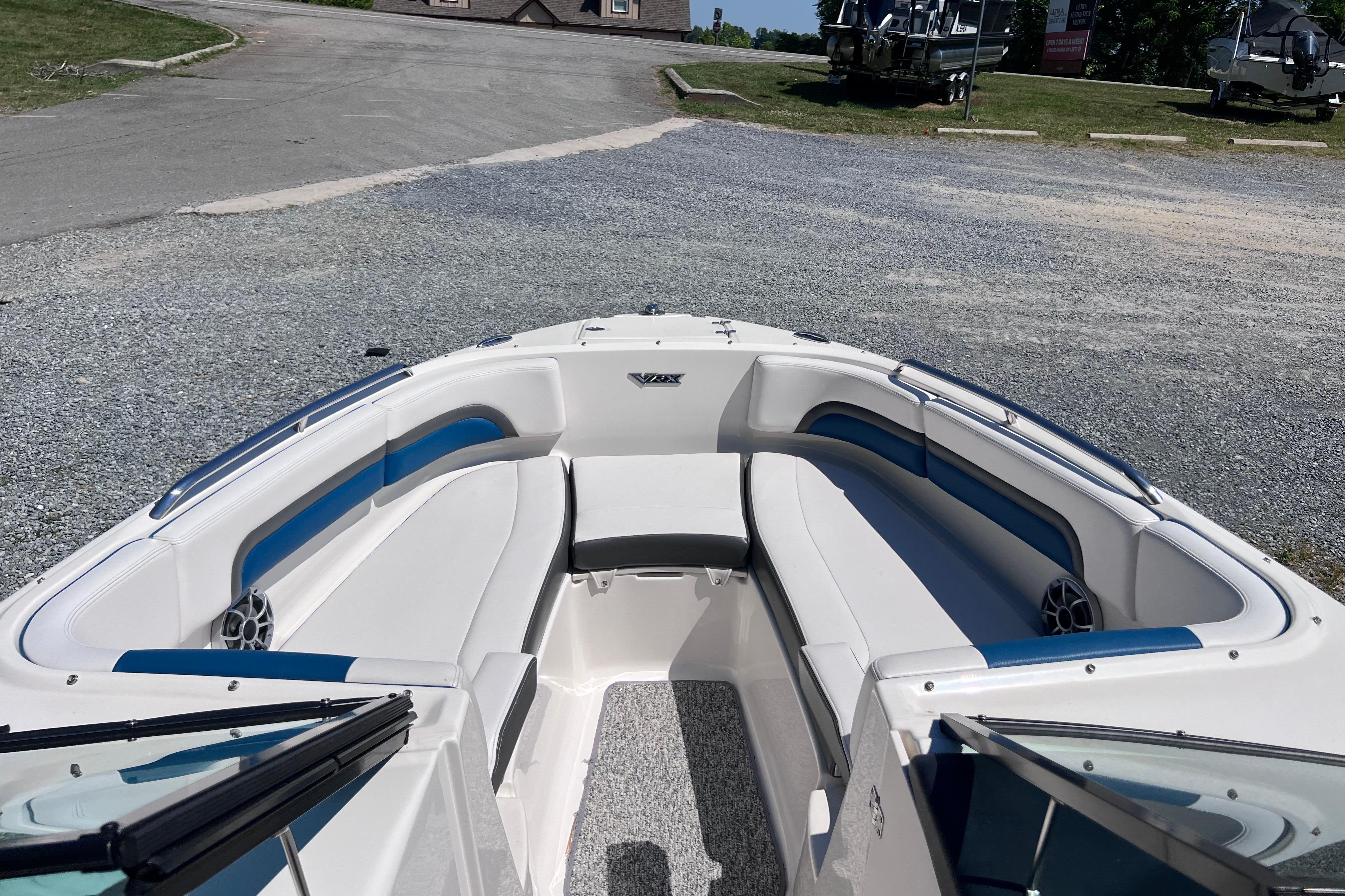 2016 Chaparral Vortex 243 VRX boat interior with white and blue seating.