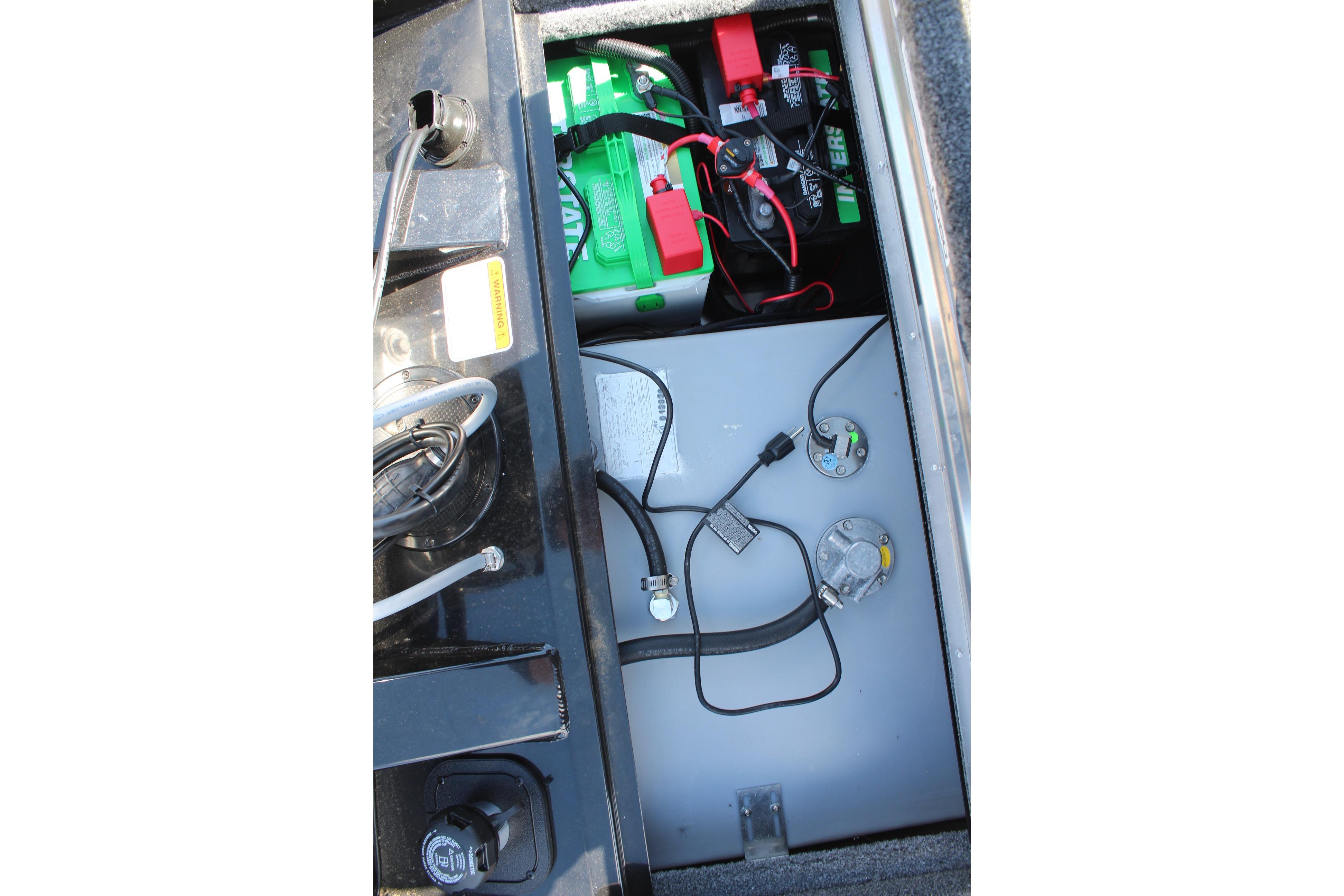 Battery compartment of 2026 Tracker Pro Team 175 Crappie Edition boat, showing wiring and connections.
