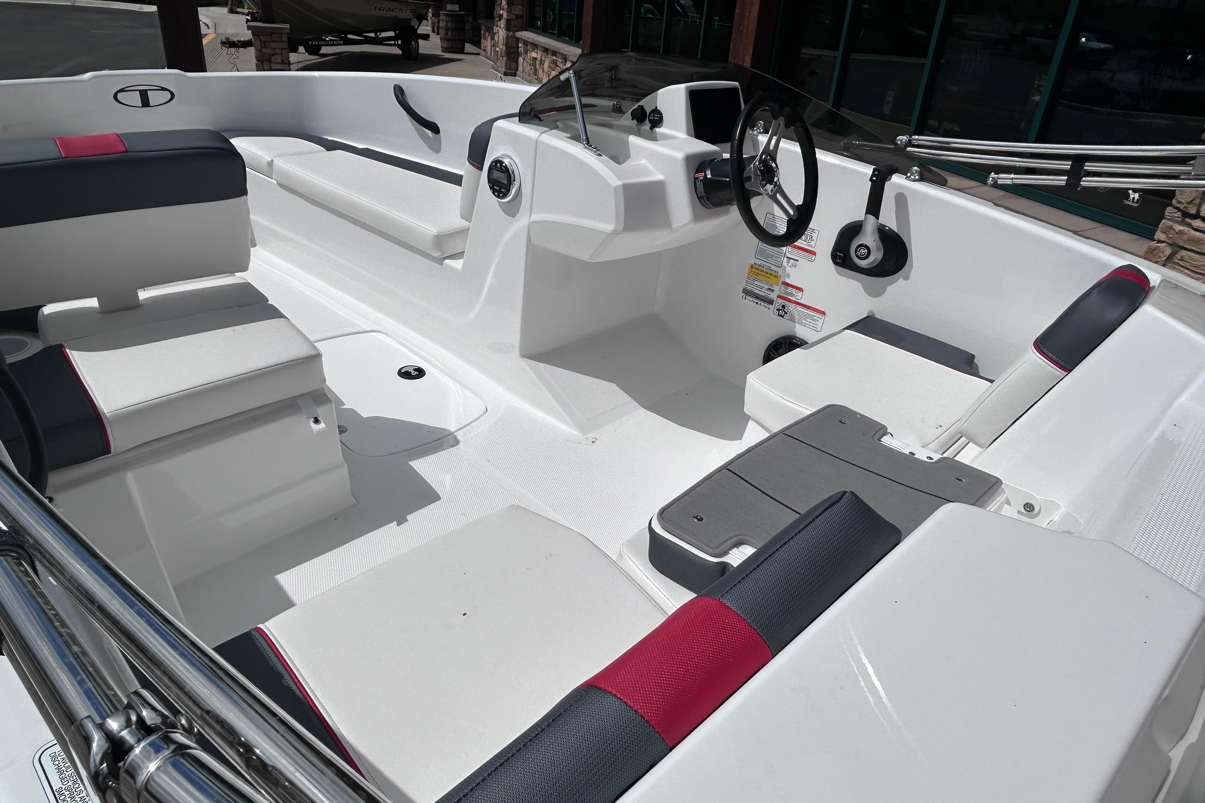 Interior of a 2026 Tahoe T16 boat, featuring sleek seating and modern controls.