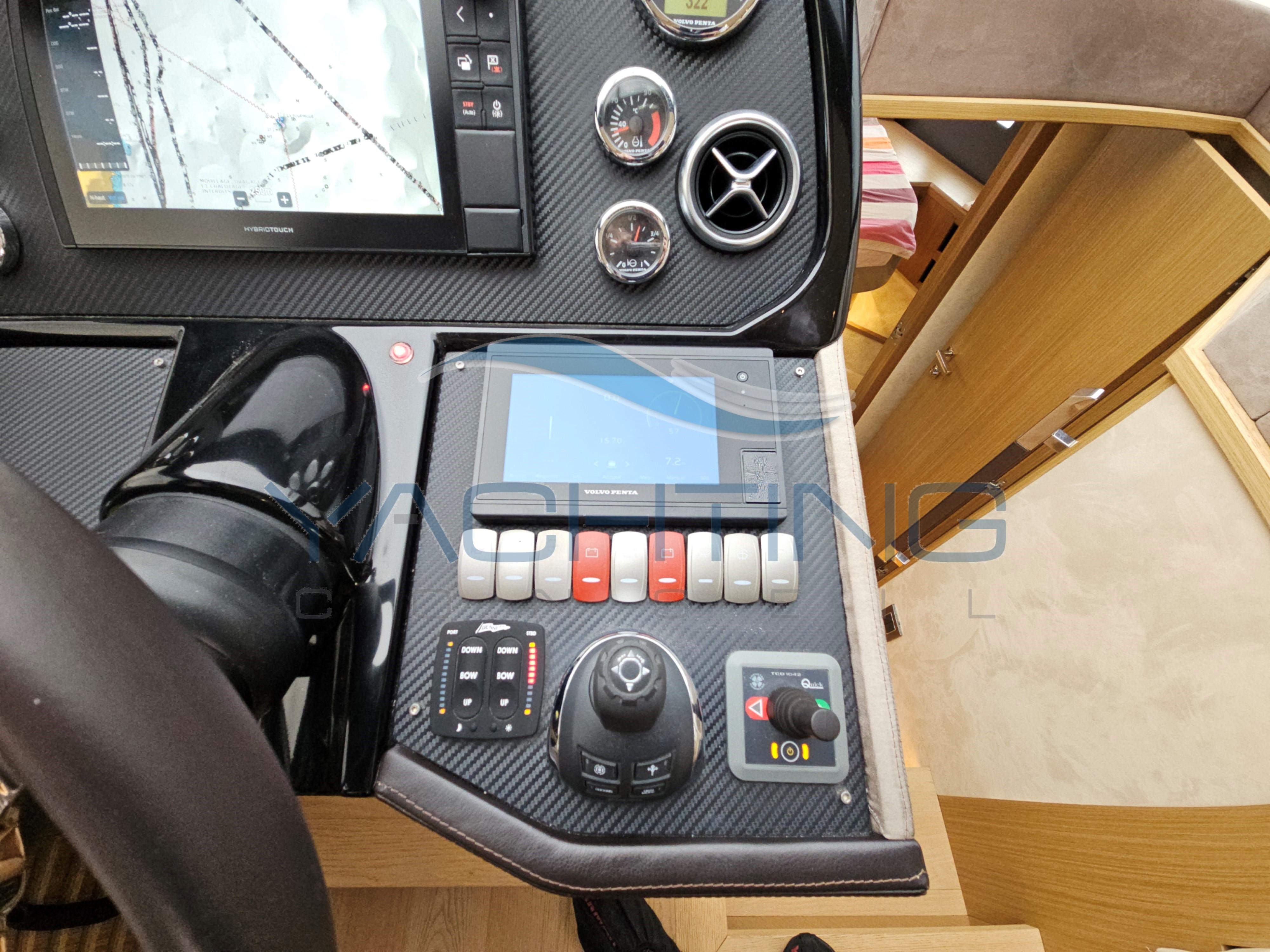 Control panel of a 2018 Absolute 45 FLY yacht with navigation and control instruments.