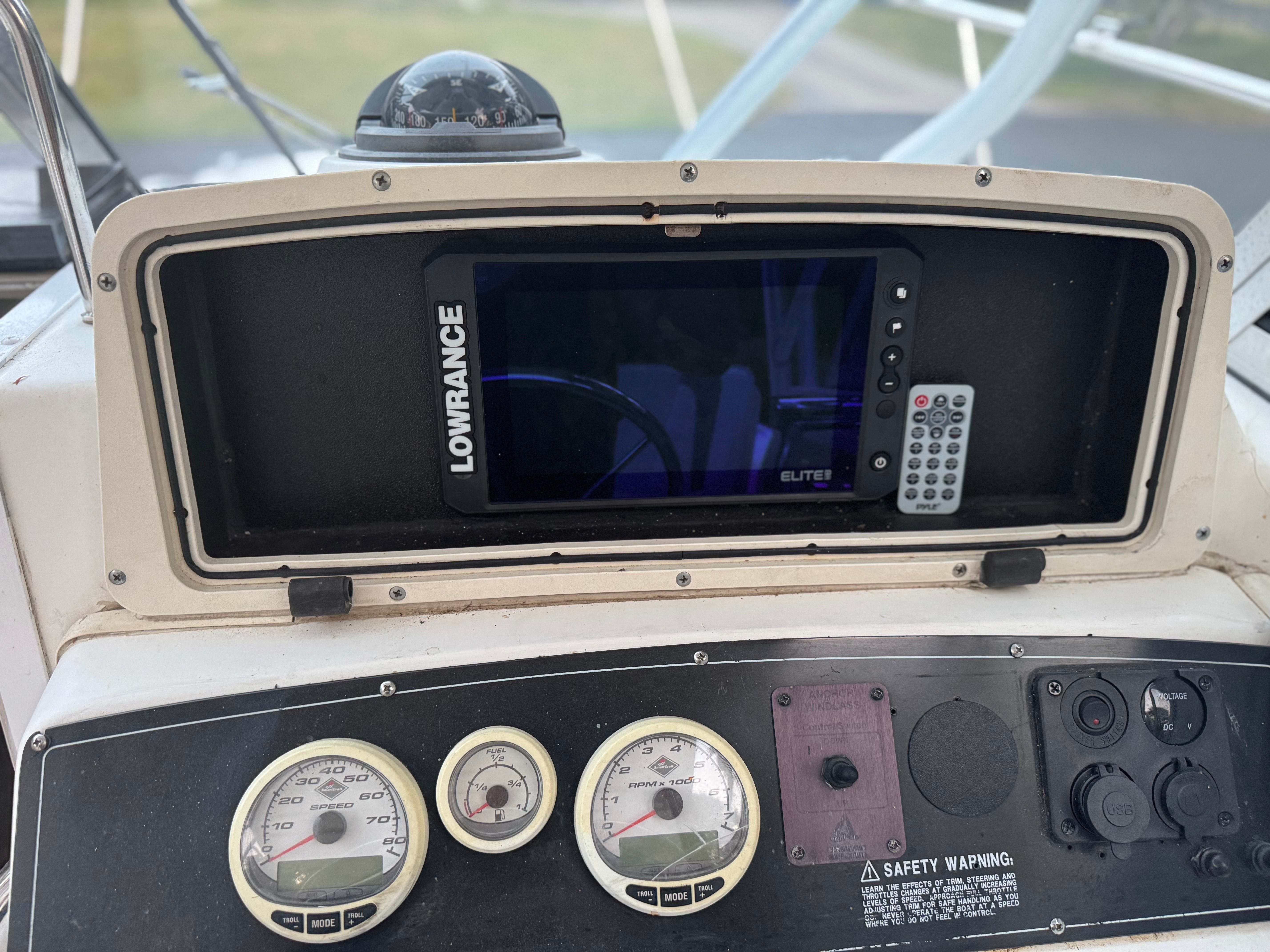 Dashboard of a 2000 Boston Whaler Conquest with Lowrance Elite display.