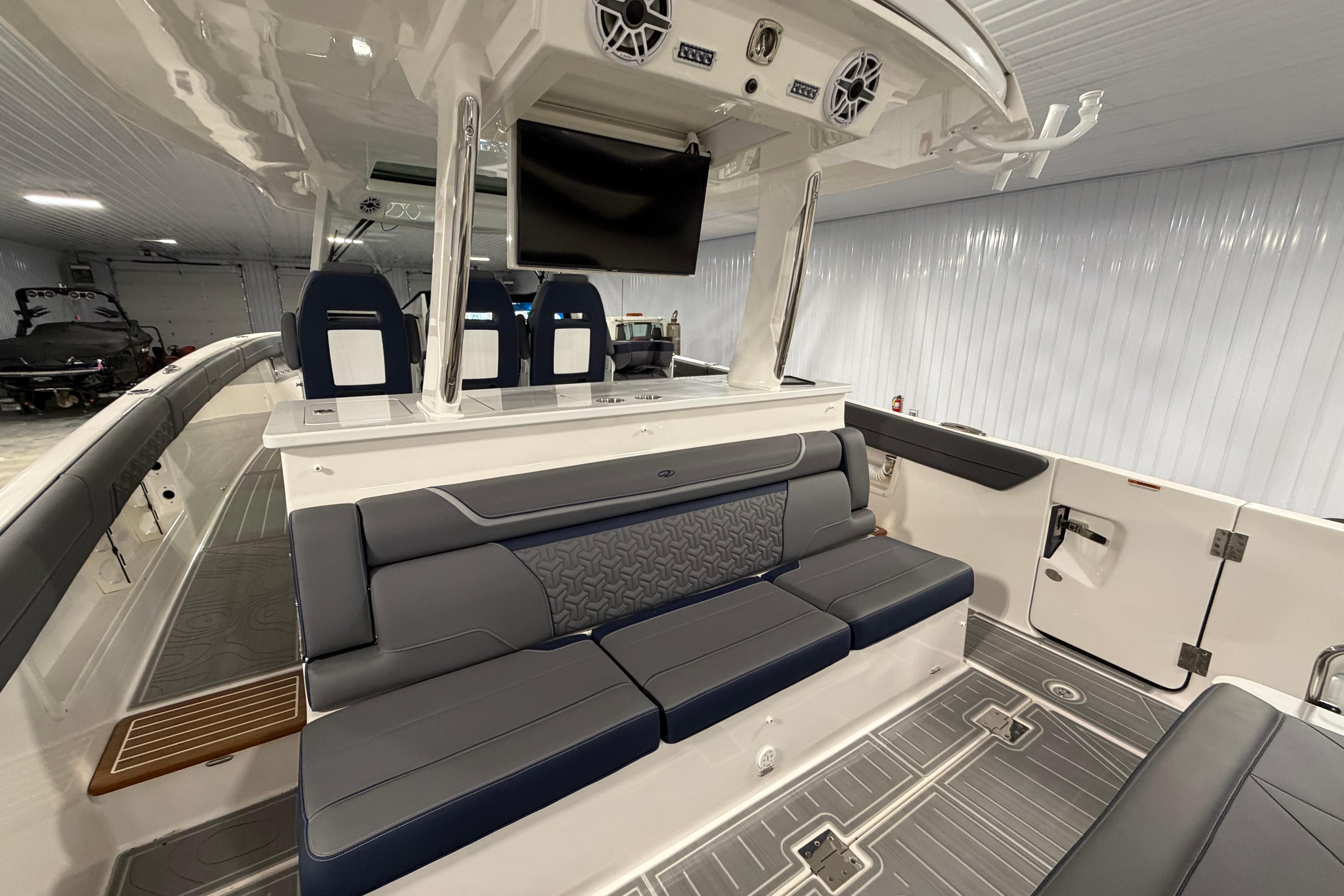 Luxurious interior of 2027 Regal 38 Surf boat with modern seating and entertainment system.