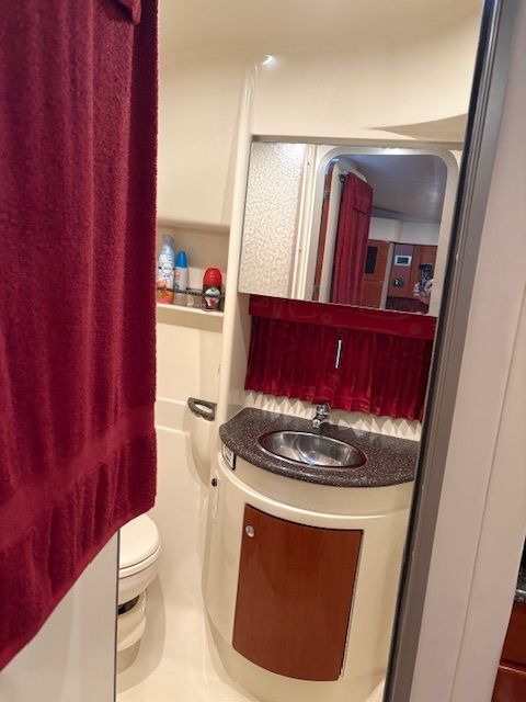 The image shows the bathroom of a 2007 Formula 34 Performance Cruiser with a sink and toilet.