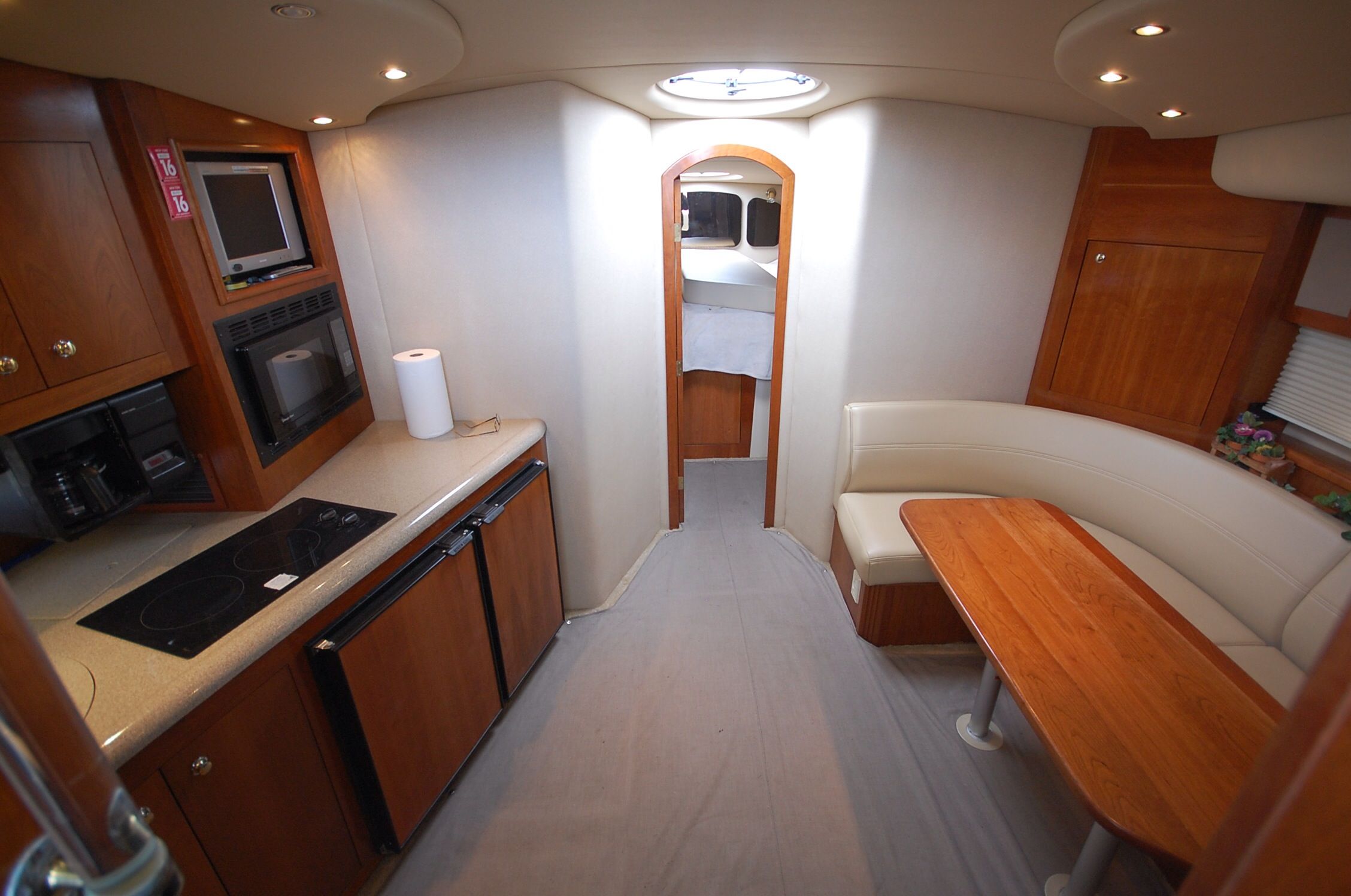 Interior of 2004 Cruisers Yachts 3970 featuring kitchen and dining area.