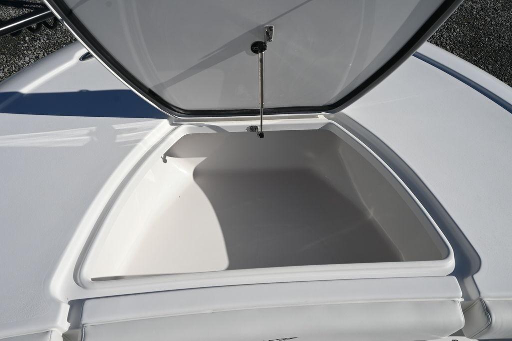 Open storage compartment on 2026 Tidewater 2500 Carolina Bay boat.