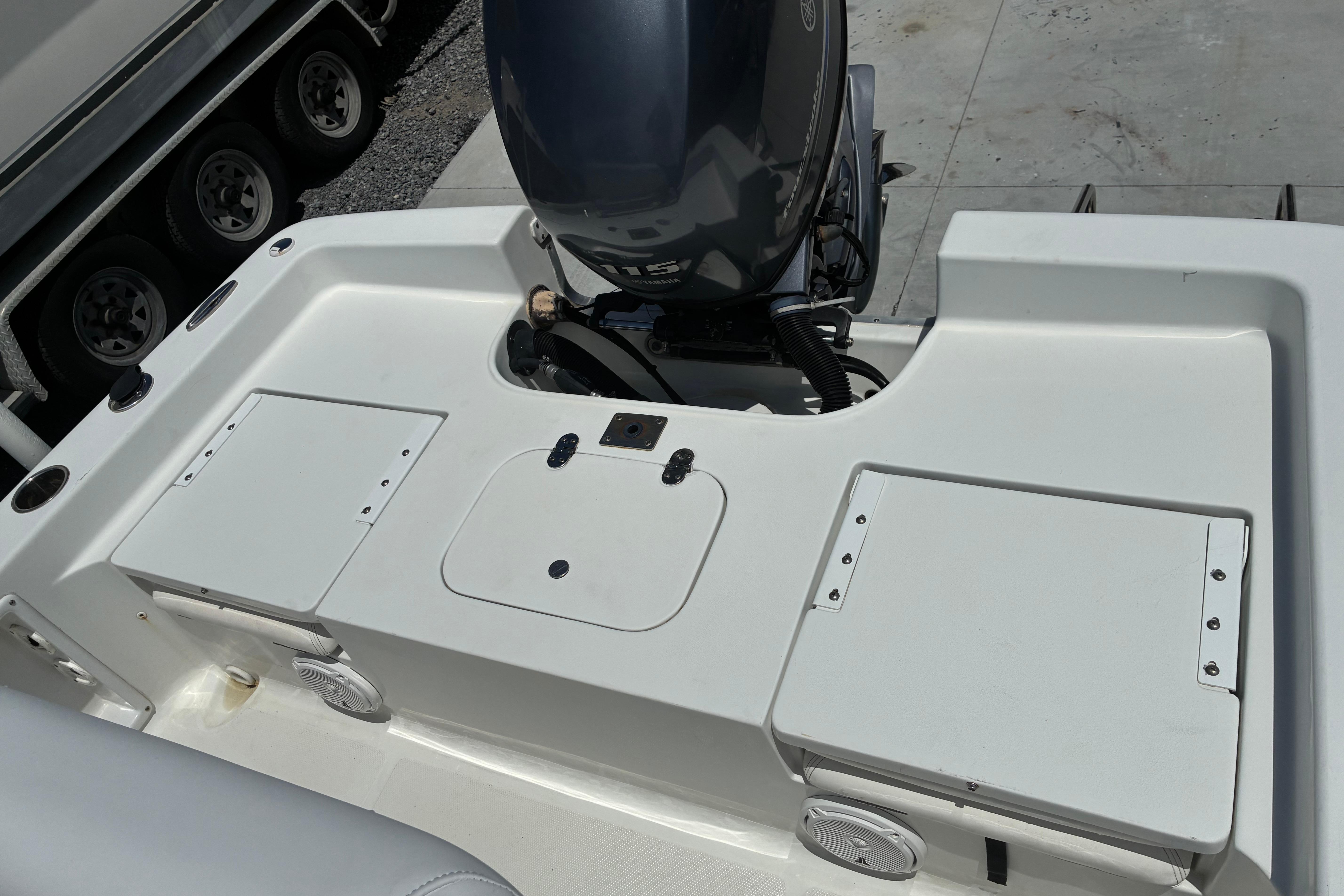 2014 Sea Hunt BX 20 BR boat with outboard motor and storage compartments.