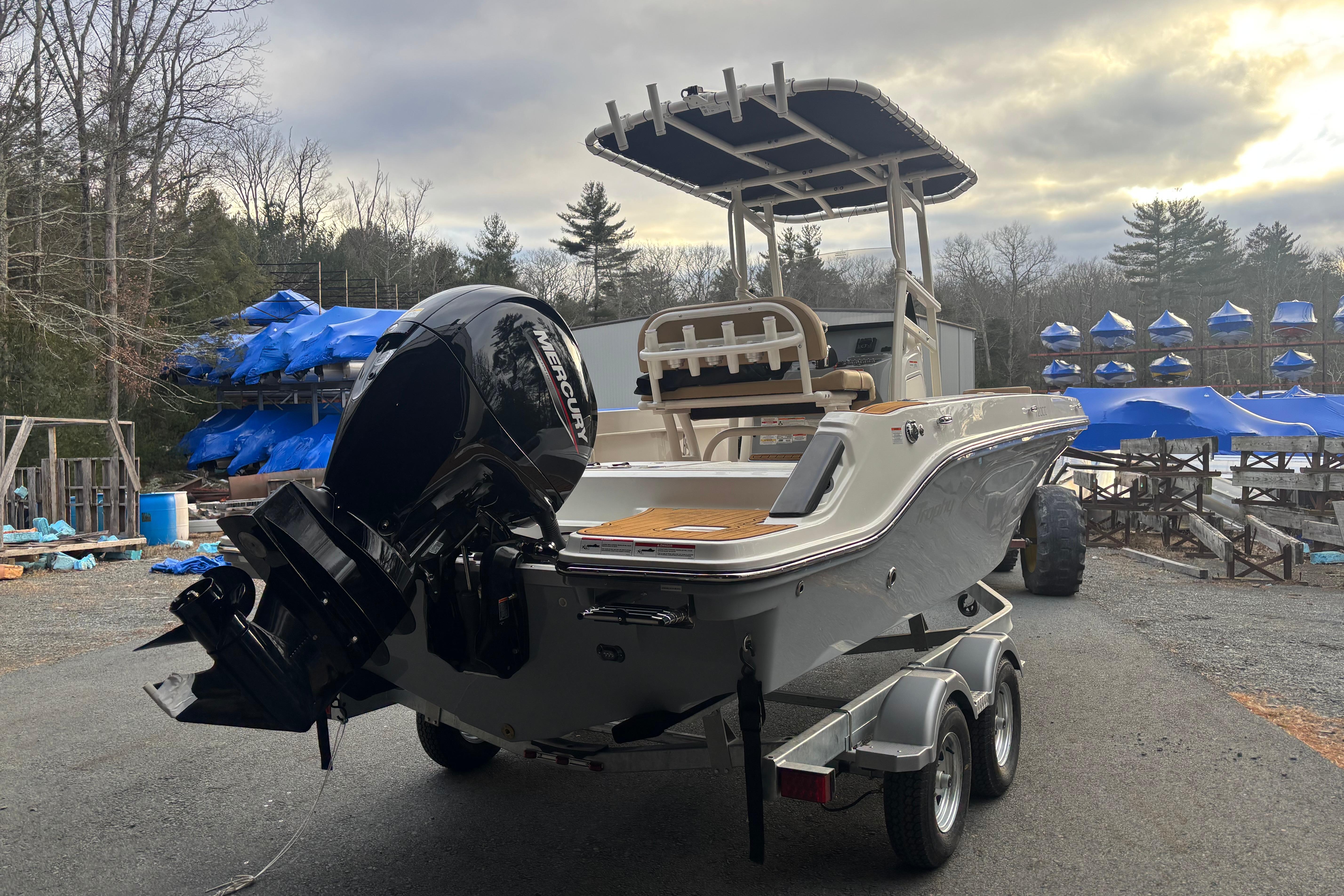 2026 Bayliner Trophy T20CC boat on trailer with Mercury outboard motor, outdoor setting.