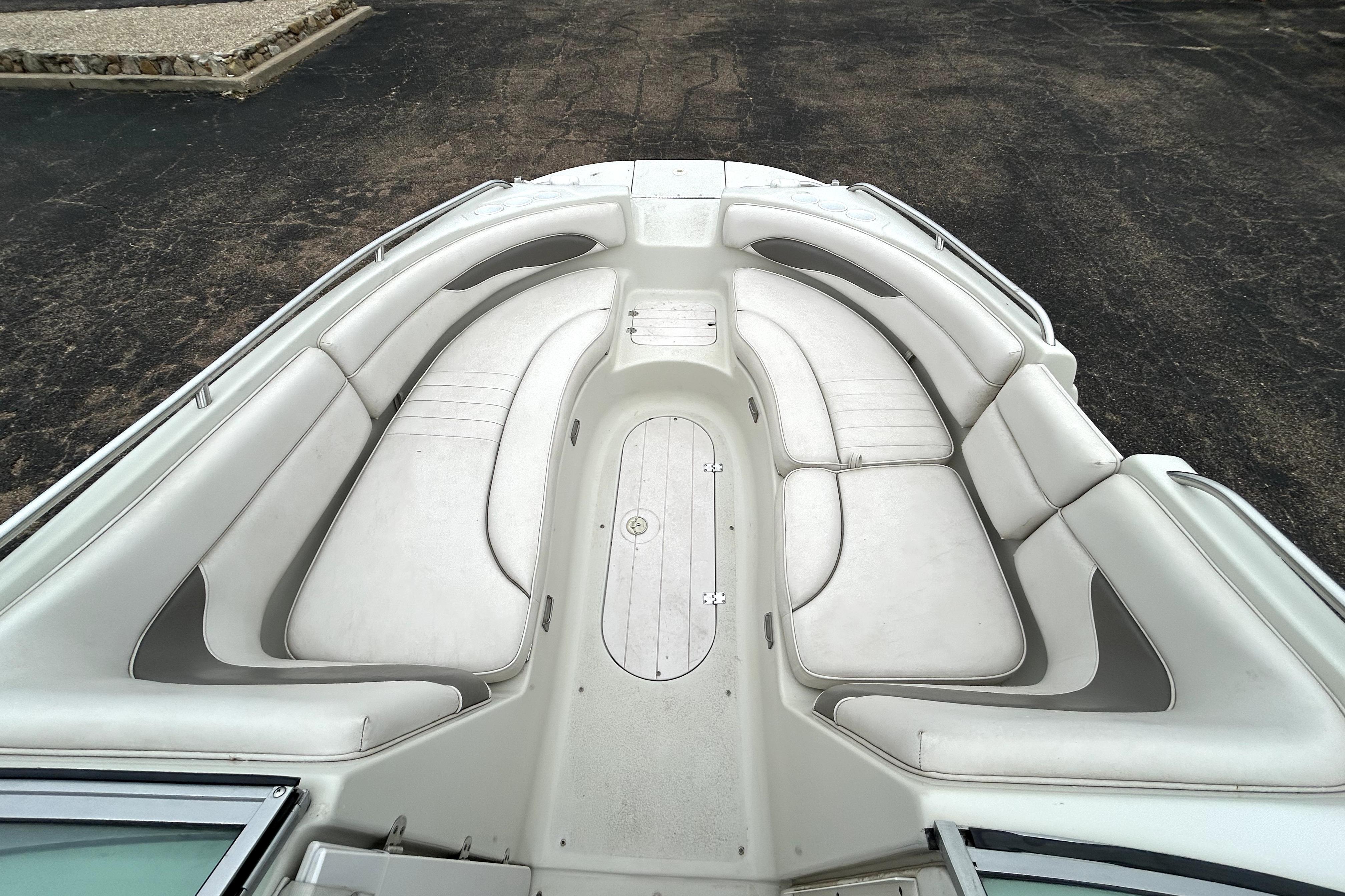 2001 Crownline 239 DB boat interior with spacious white seating arrangement.