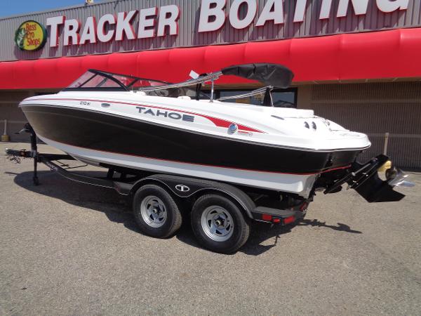 2023 Tahoe 210 Si boat on trailer outside Tracker Boating store.