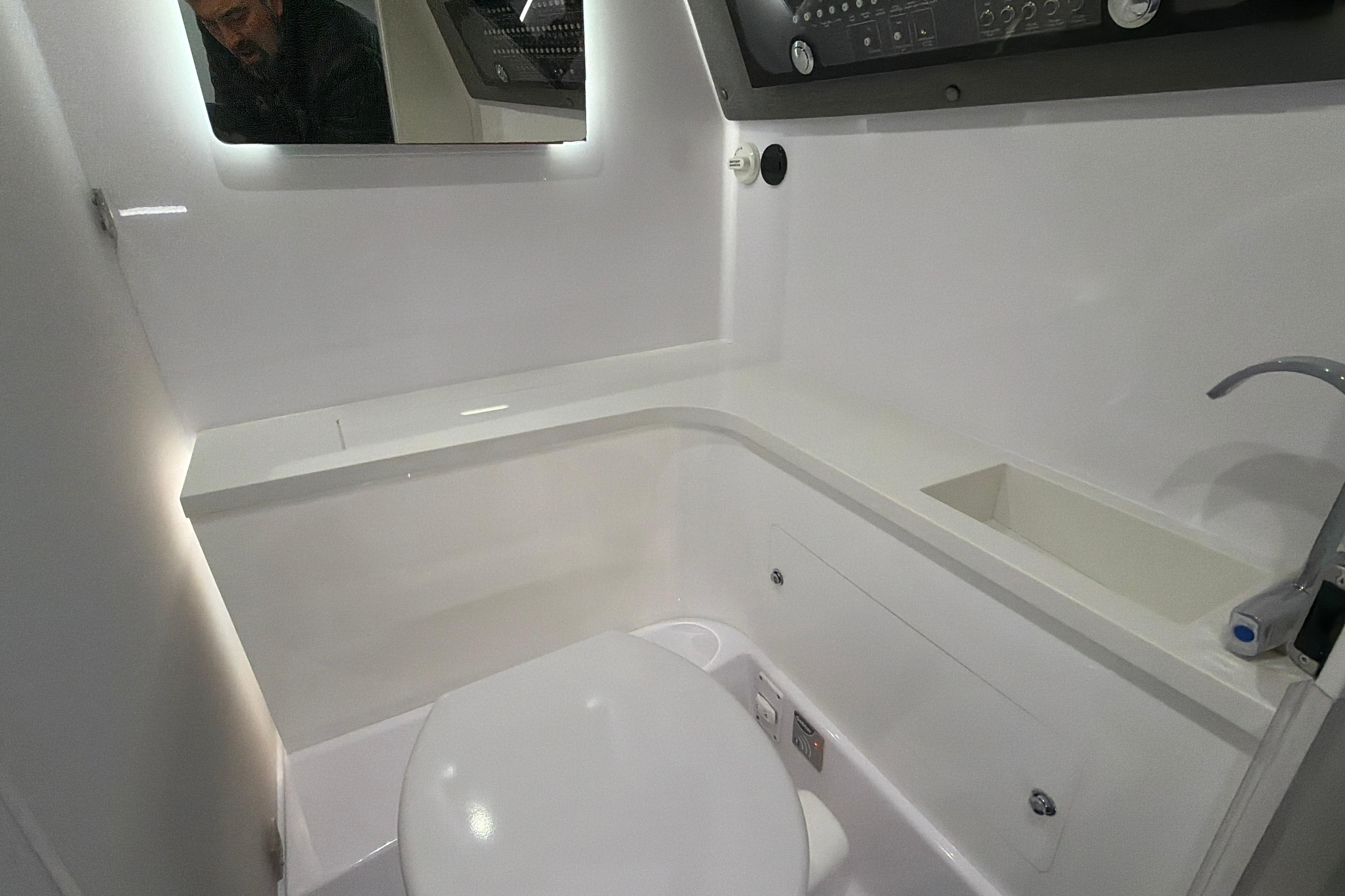 Interior of 2022 Axopar Brabus 37 XC Cross Cabin bathroom with modern fixtures.