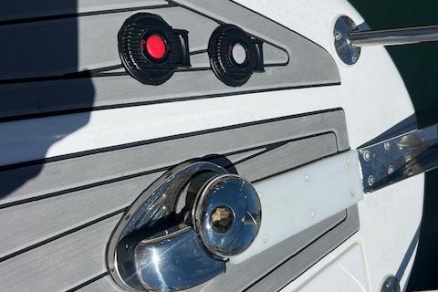 Deck of 2024 Bracewell 25 boat with cleat and control buttons.