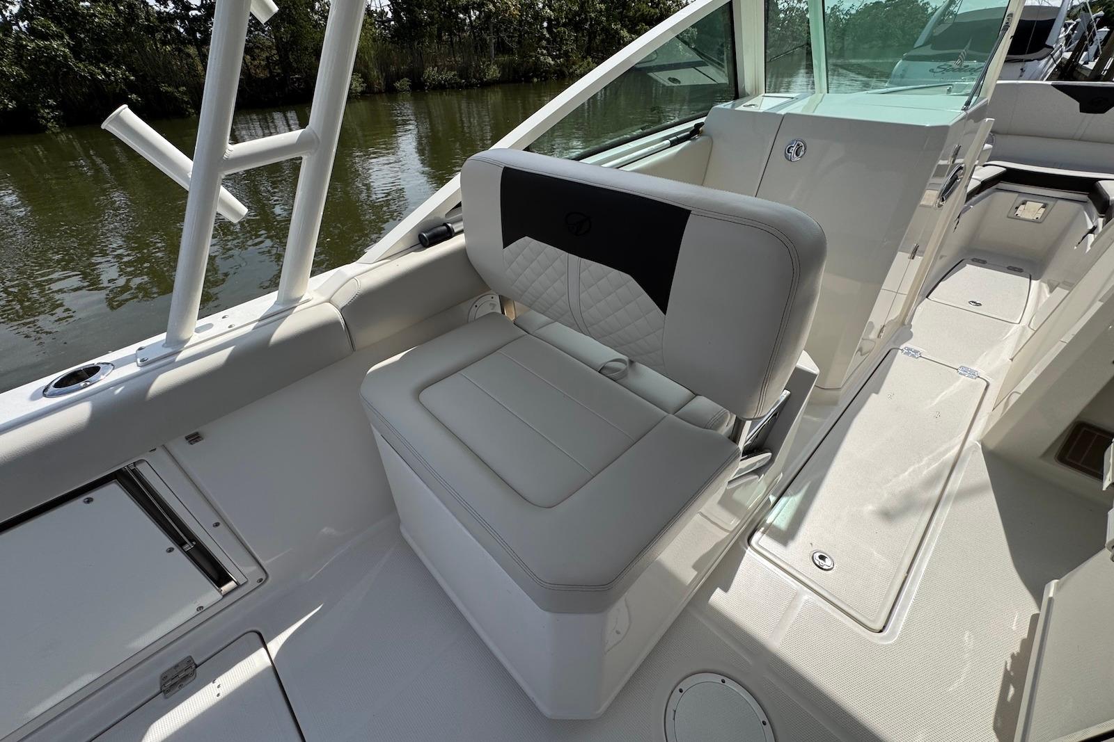 2022 Sailfish 276 DC boat interior with white seating and sleek design.