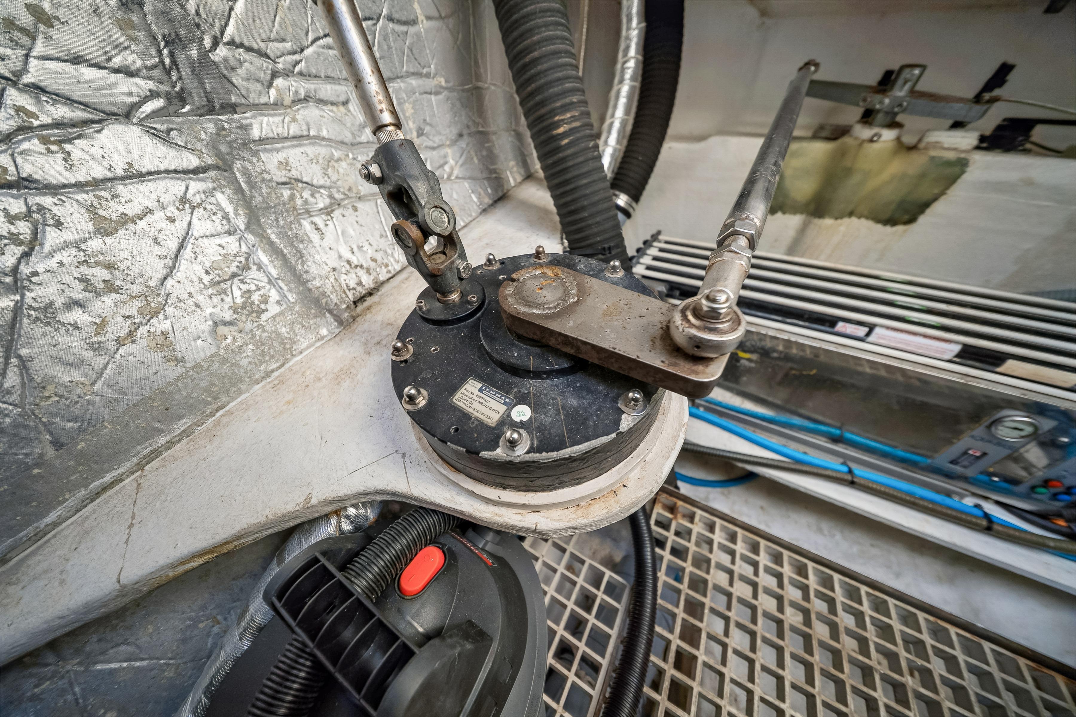 Mechanical components in the engine room of a 2009 Catana 65 yacht.