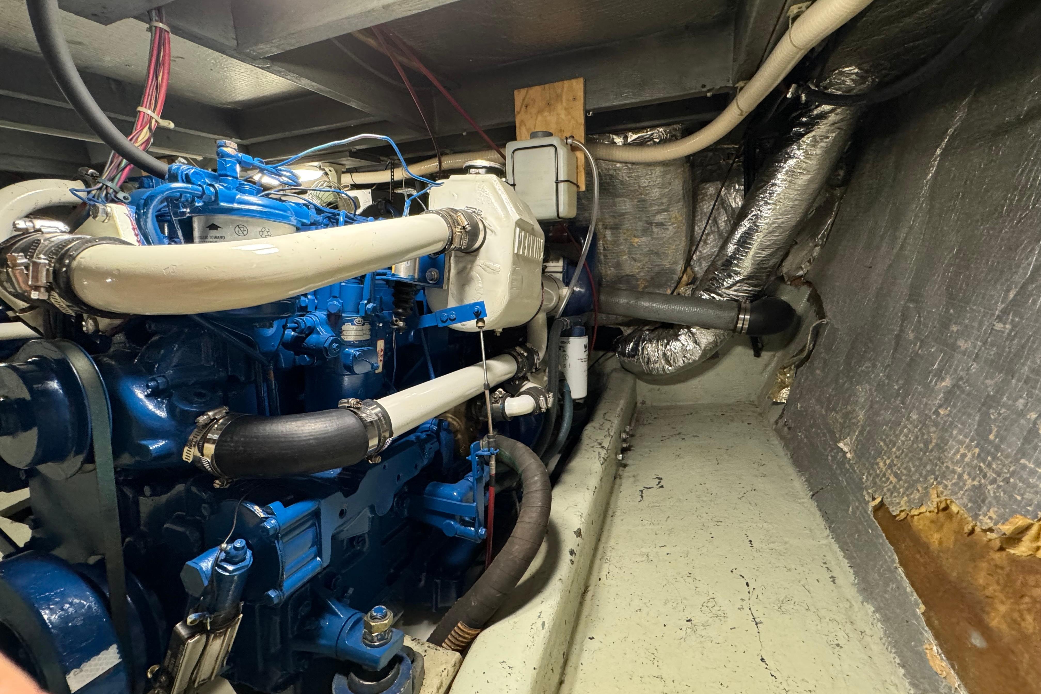 Engine room of a 1978 Californian 42 LRC yacht, showcasing detailed machinery.
