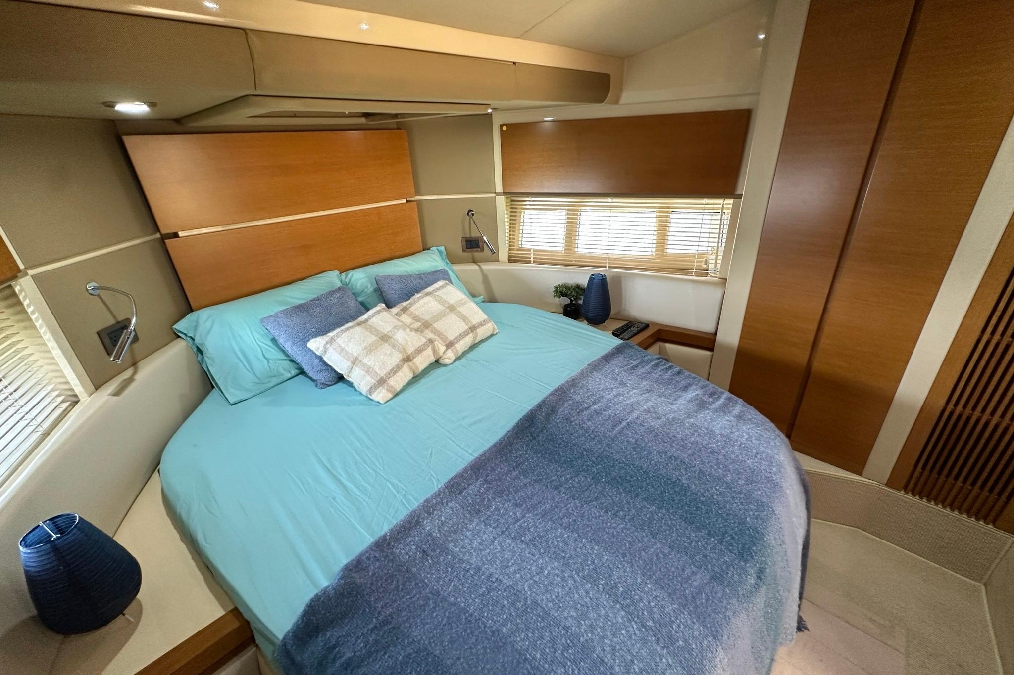 Luxurious bedroom interior of 2013 Azimut Fly 53 yacht with modern decor.
