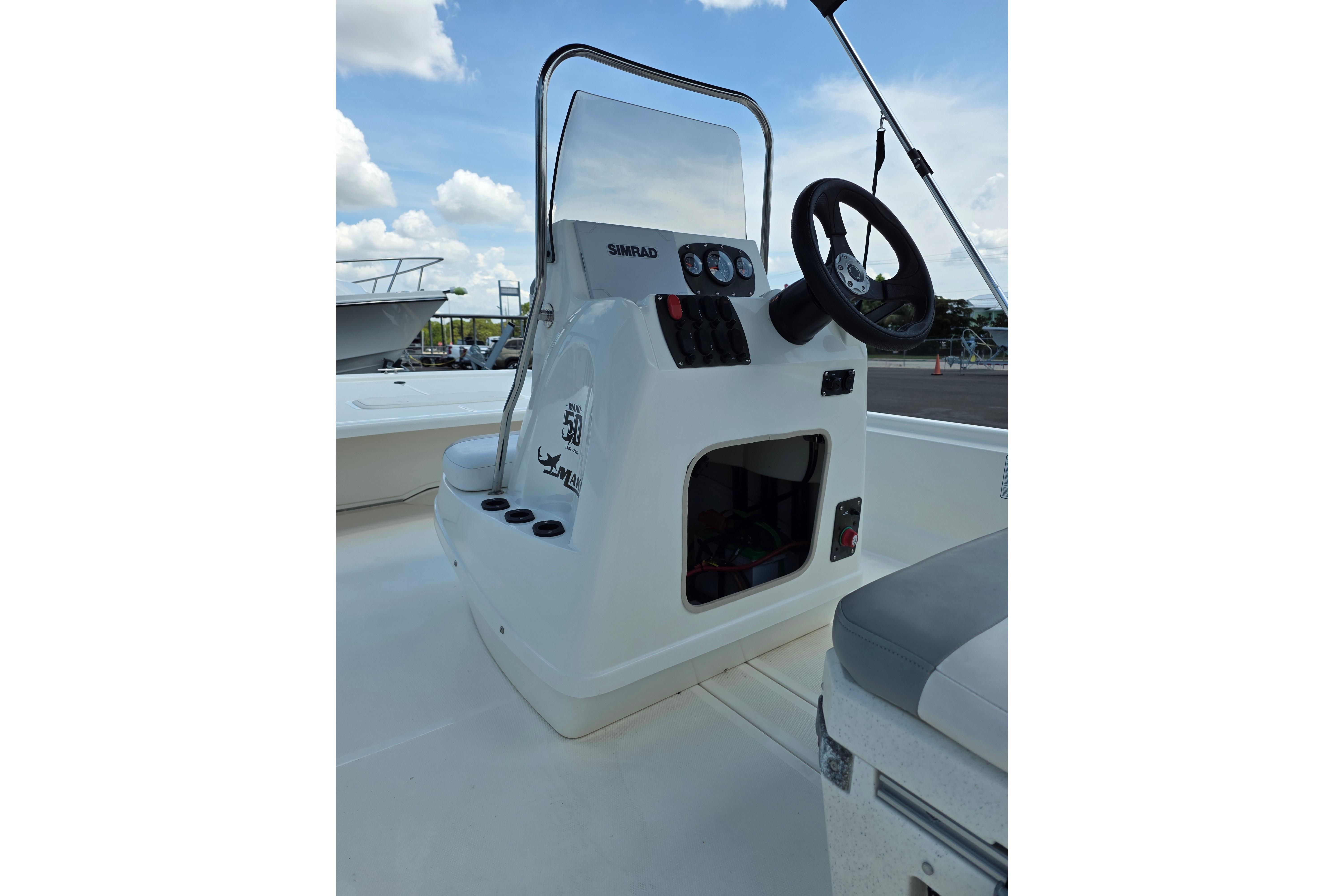 2018 Mako Pro Skiff 19 CC boat console with steering wheel and controls.