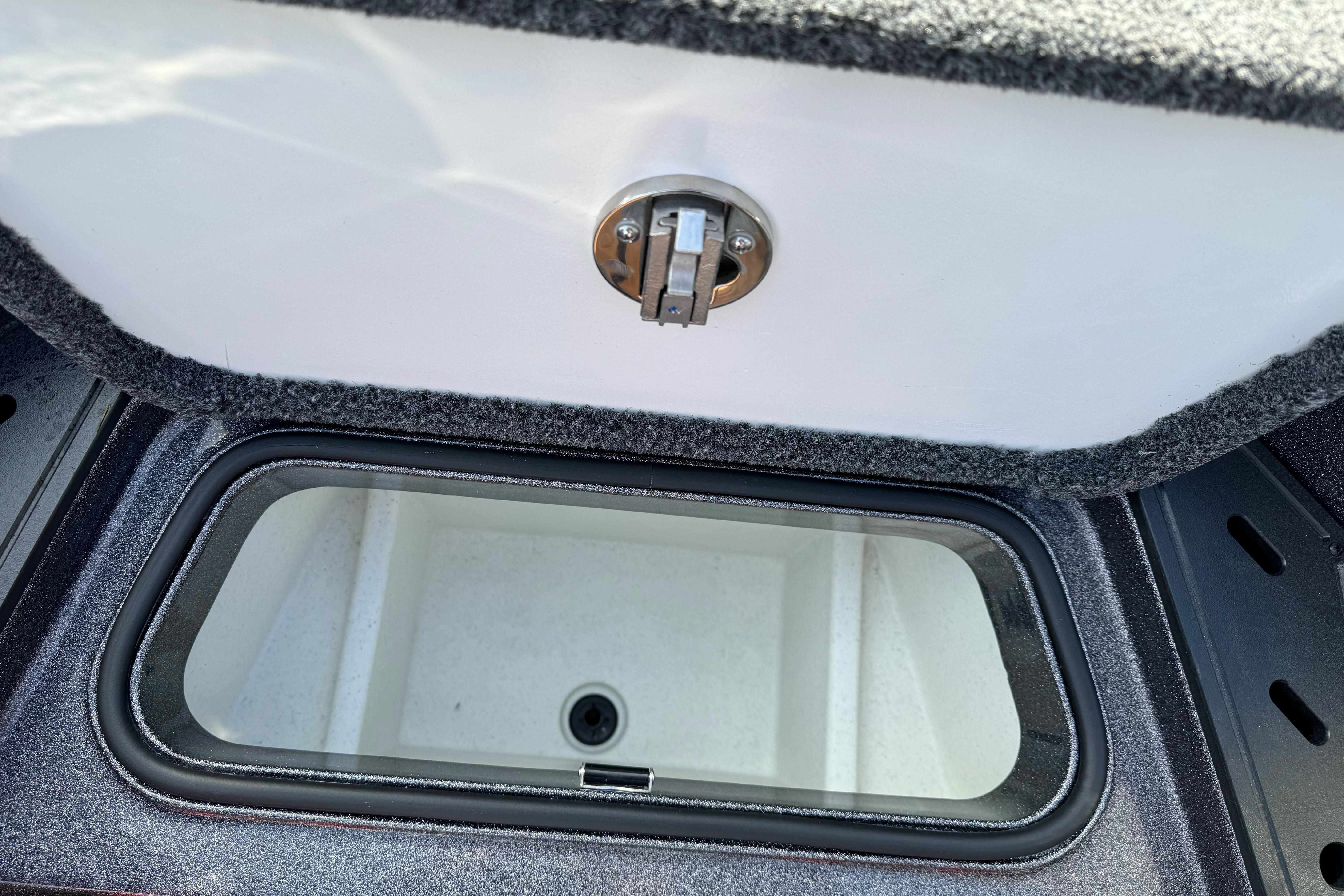 Open storage compartment in 2025 Ranger Z521 boat.