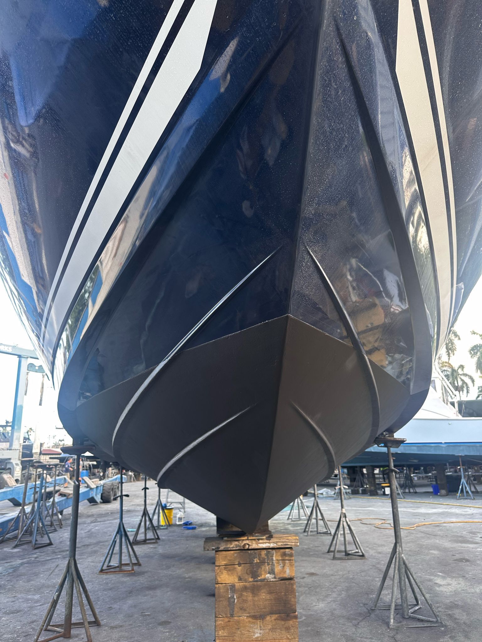 2010 Sea Ray 450 boat hull on stands in dry dock.