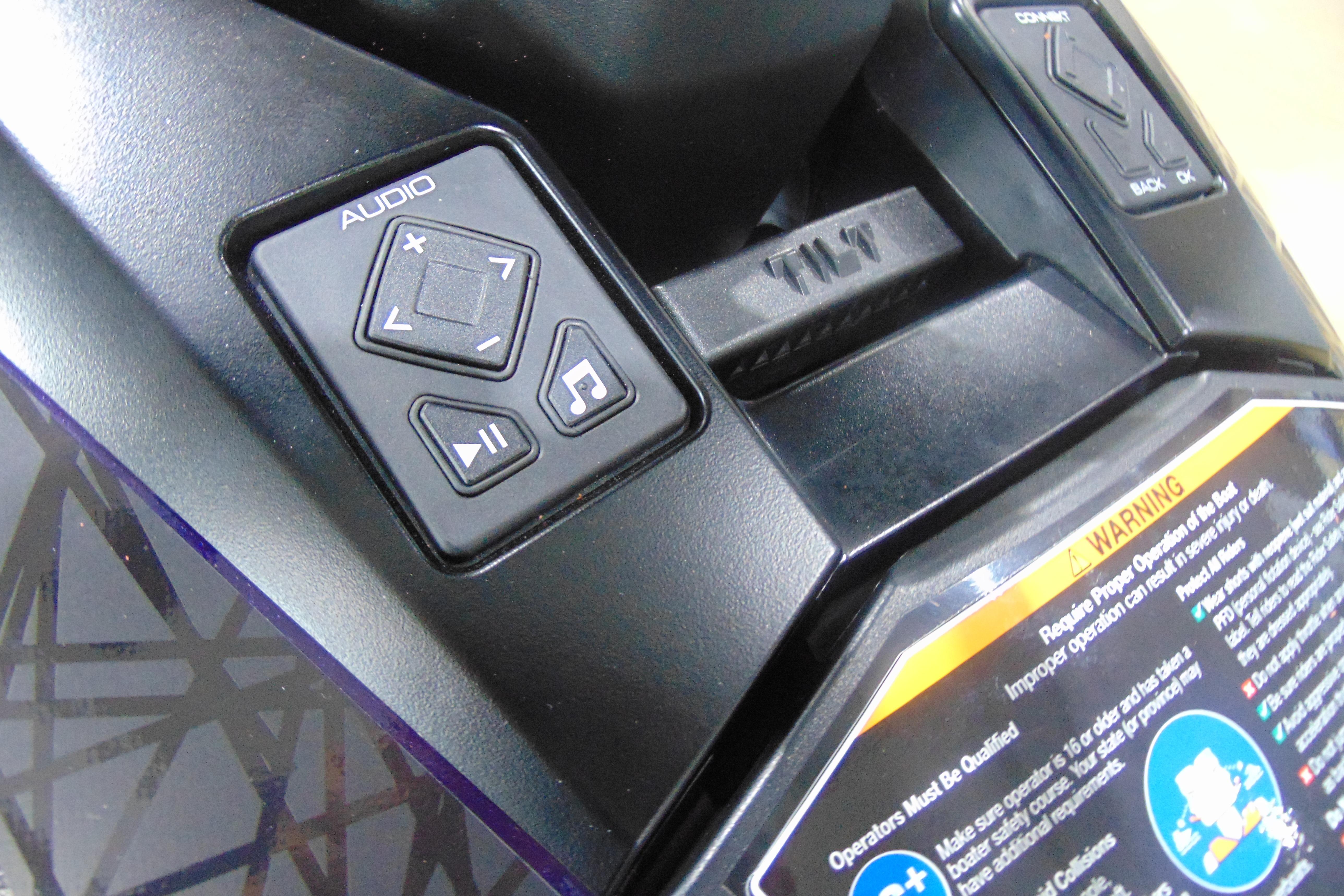 2026 Yamaha WaveRunner GP HO audio controls and warning label close-up.