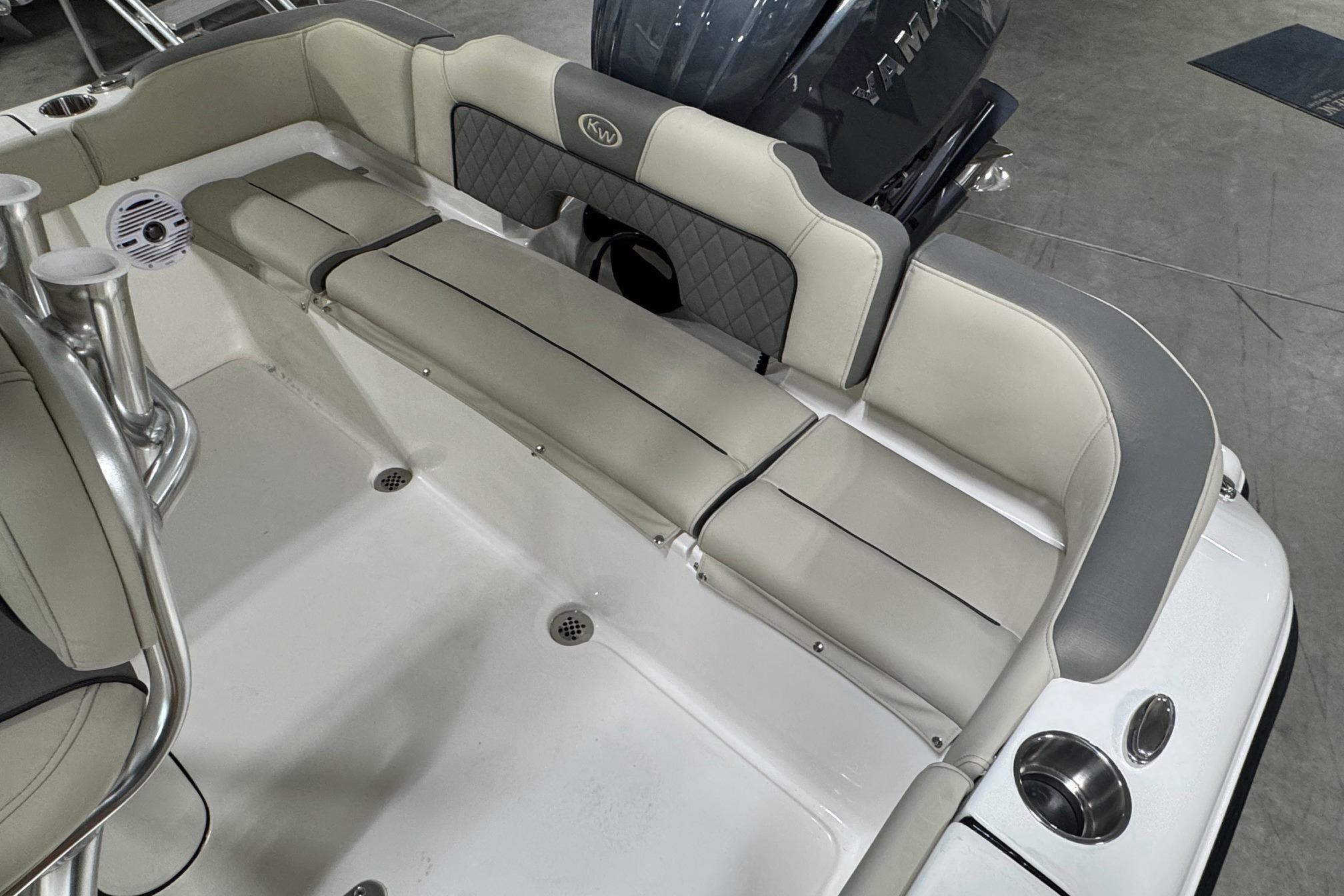 2026 Key West 203 FS boat interior with cushioned seating and speaker system.
