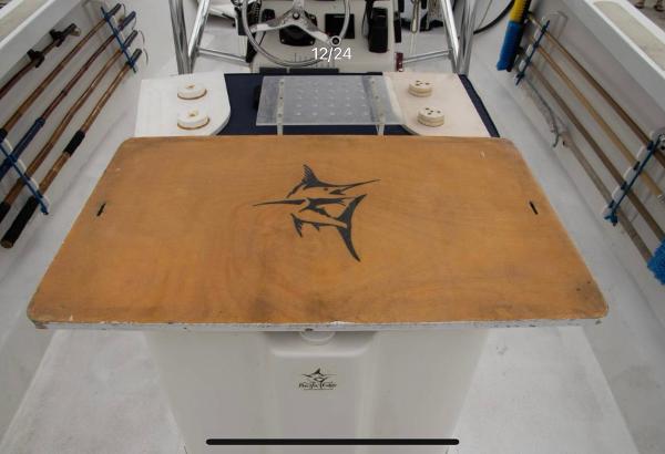 1979 Chaparral 224 Fisherman boat interior with fishing rods and marlin logo.