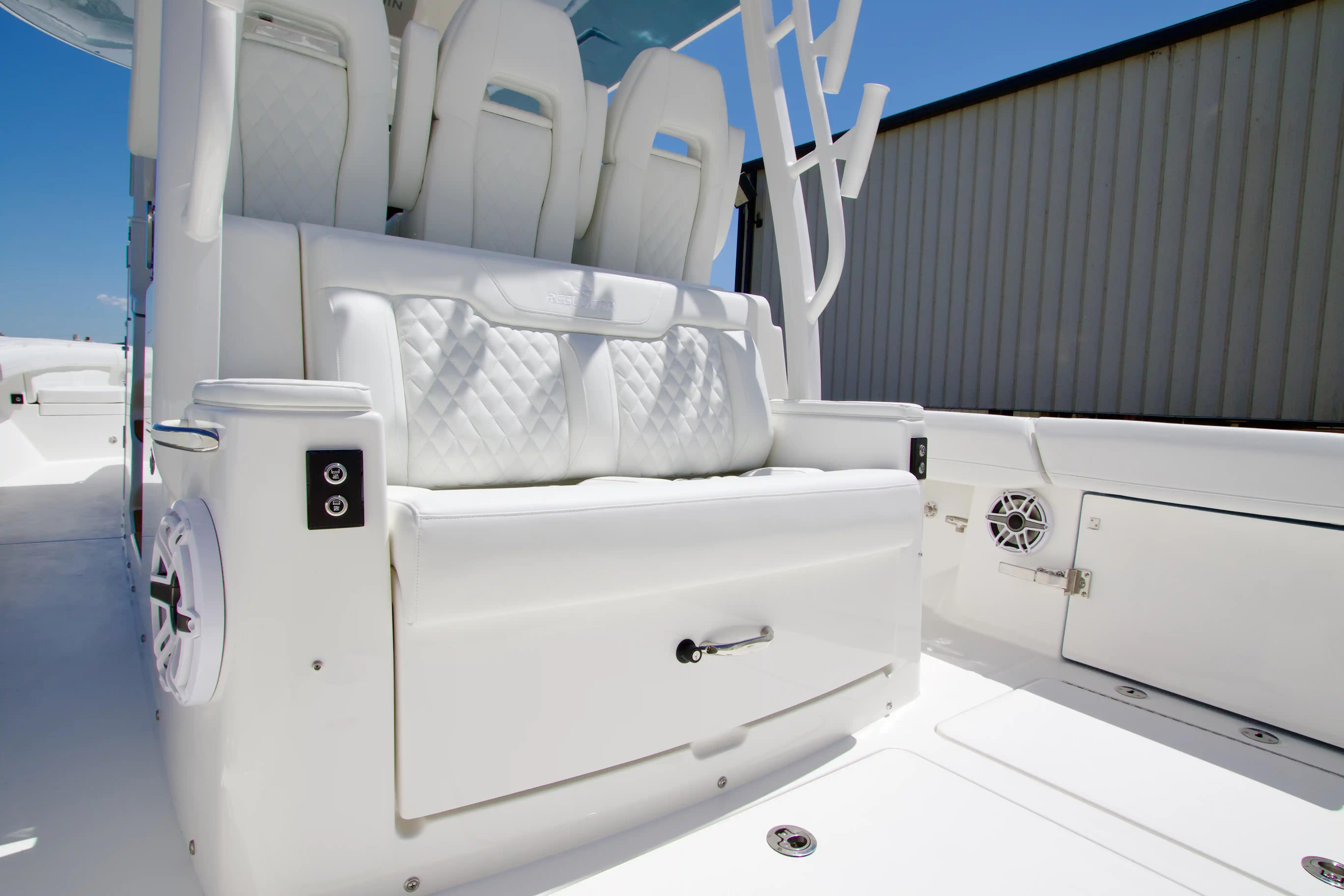 Luxurious seating on 2027 Regulator 35 boat, featuring white quilted upholstery and modern design.