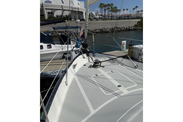 1982 Lancer 45 Motorsailer docked, showcasing deck and rigging in a marina setting.