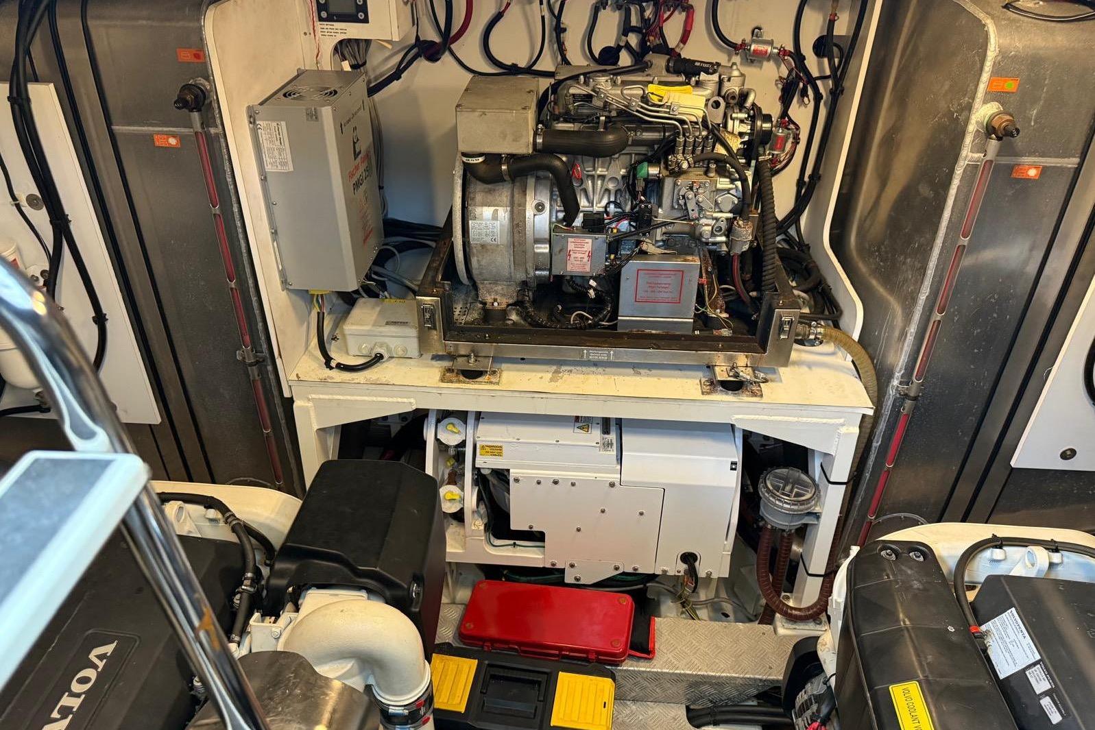 Engine room of a 2019 Prestiage 630 yacht, showcasing machinery and components.