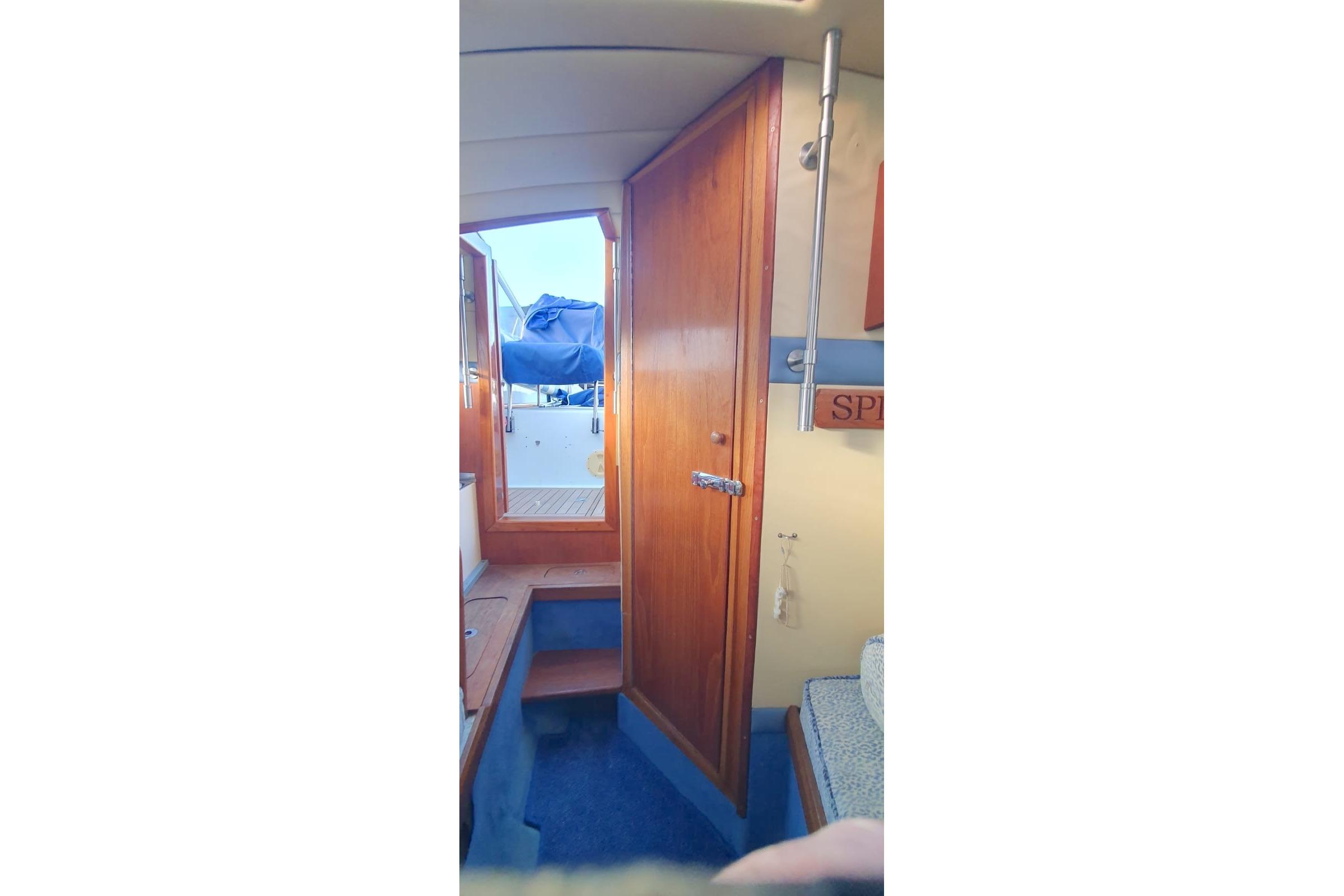 Interior view of 1989 Fairey Spearfish MKIII boat with wooden door and steps.