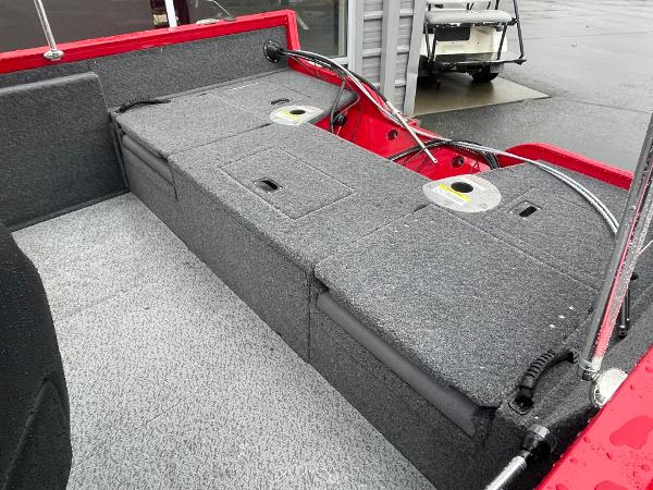 2021 Crestliner 1650 Fish Hawk SC boat interior with storage compartments and red accents.