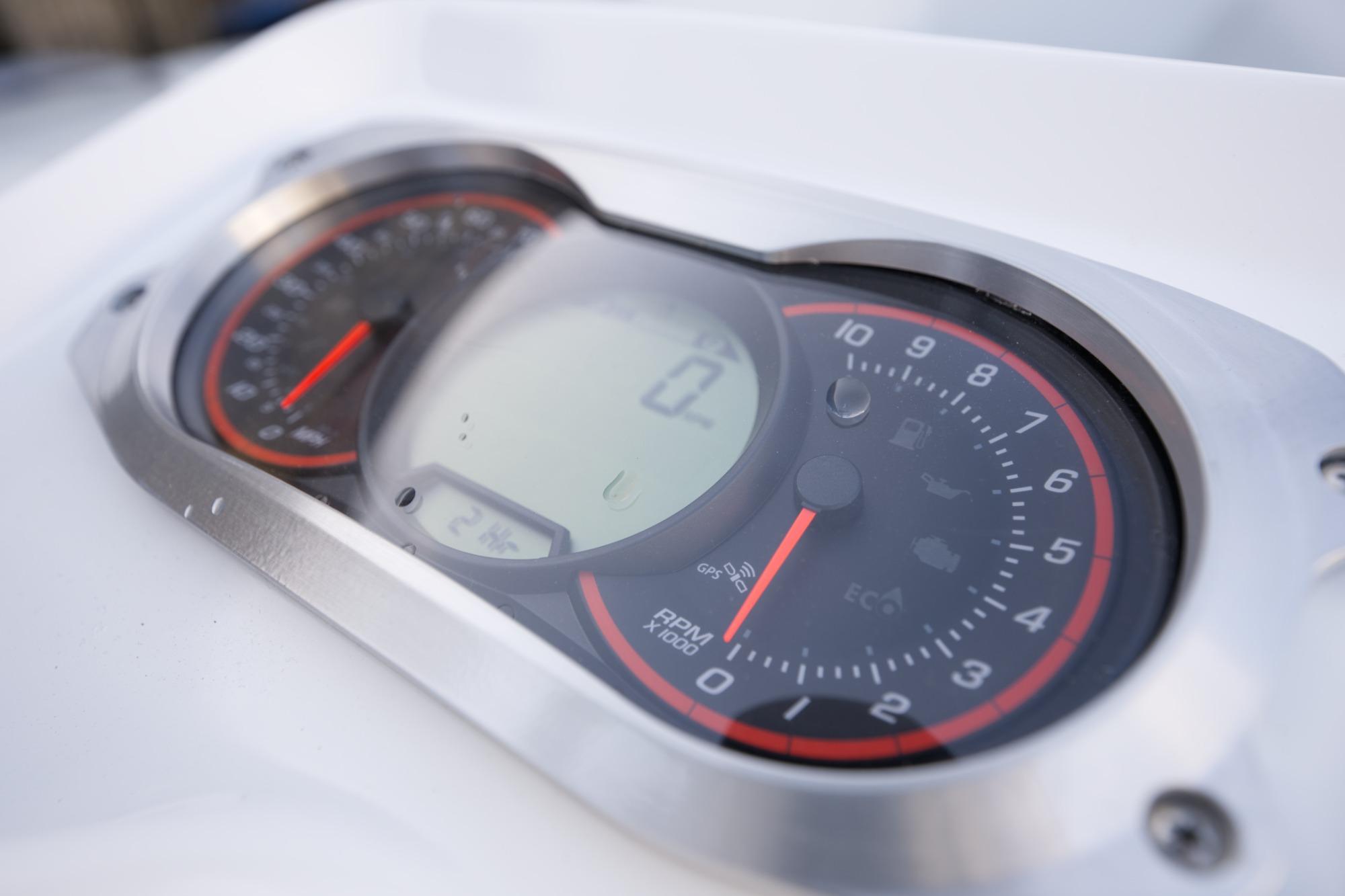Close-up of 2023 AB Inflatables 350 XP boat dashboard with gauges.