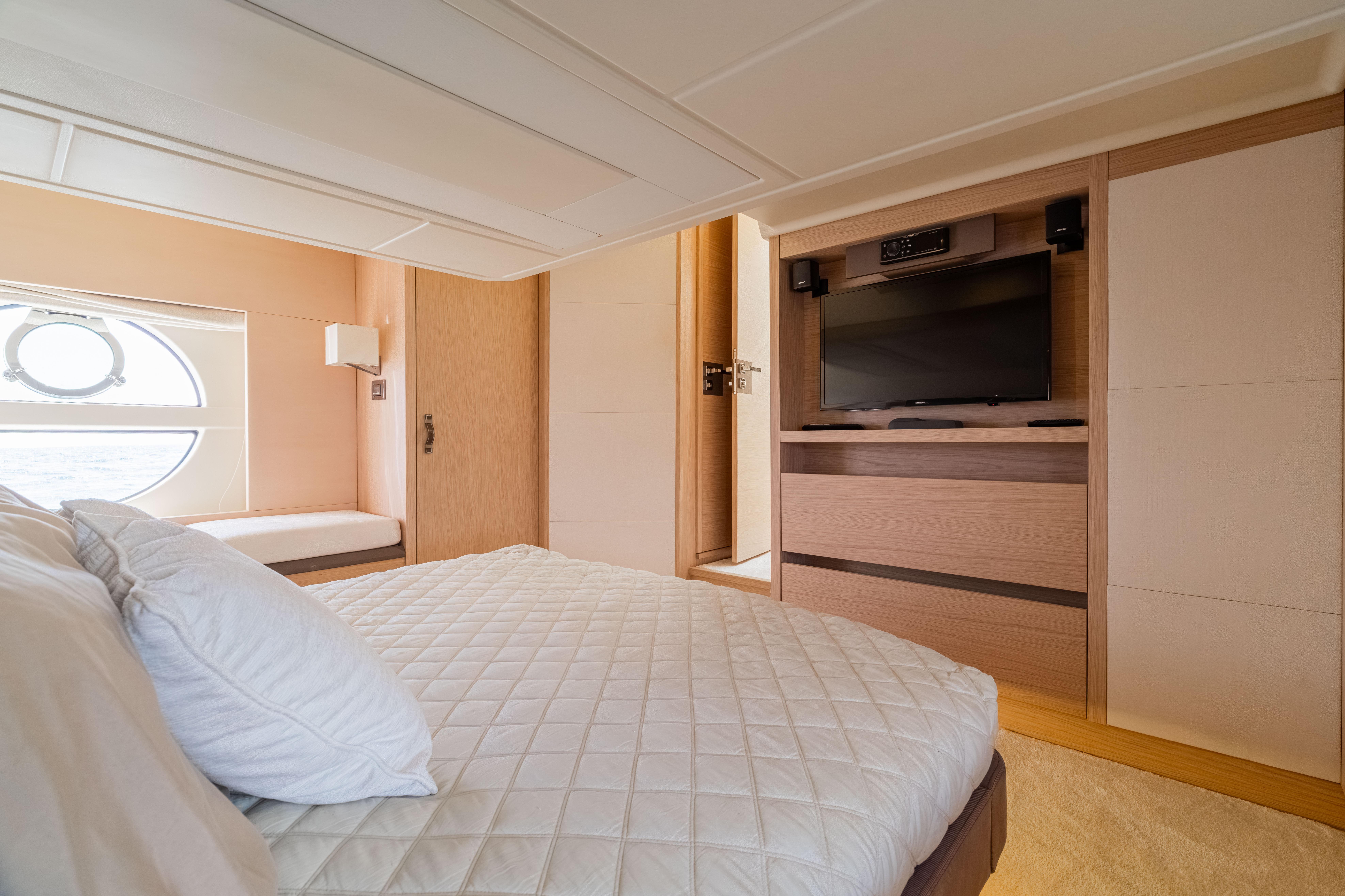 Luxurious 2017 Monte Carlo Yachts MC5 bedroom with elegant decor and modern amenities.