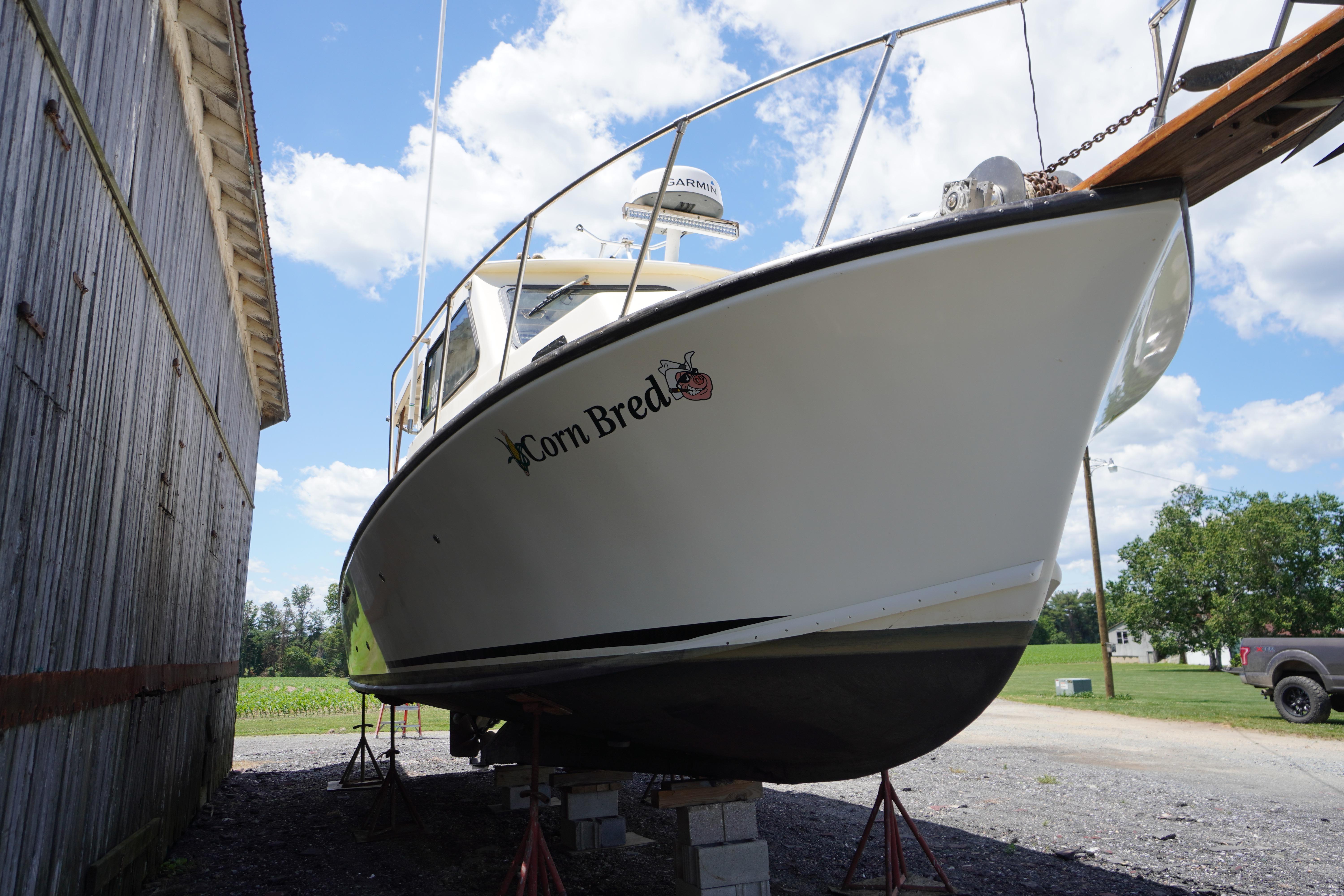 1989 Markley 35 Ft. Deadrise boat named "Corn Bred" on dry dock.