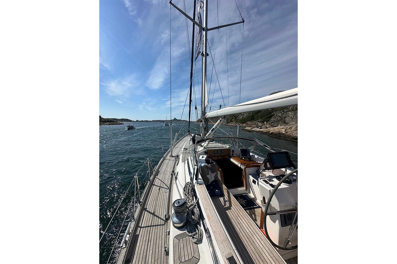 Sailing yacht Najad 460, 2004 model, cruising on a sunny day with clear skies.