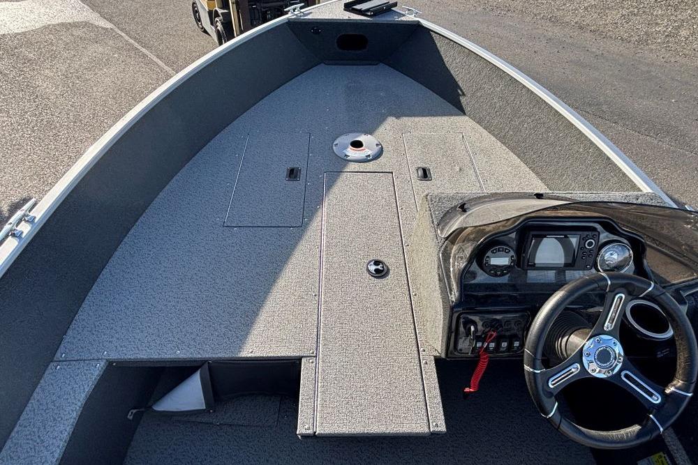 2024 Starweld 16 Fusion SC Pro boat interior with steering console and storage compartments.