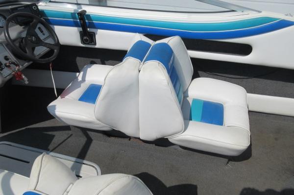 Interior seating of a 1993 Rinker 186 Captiva boat with blue and white upholstery.