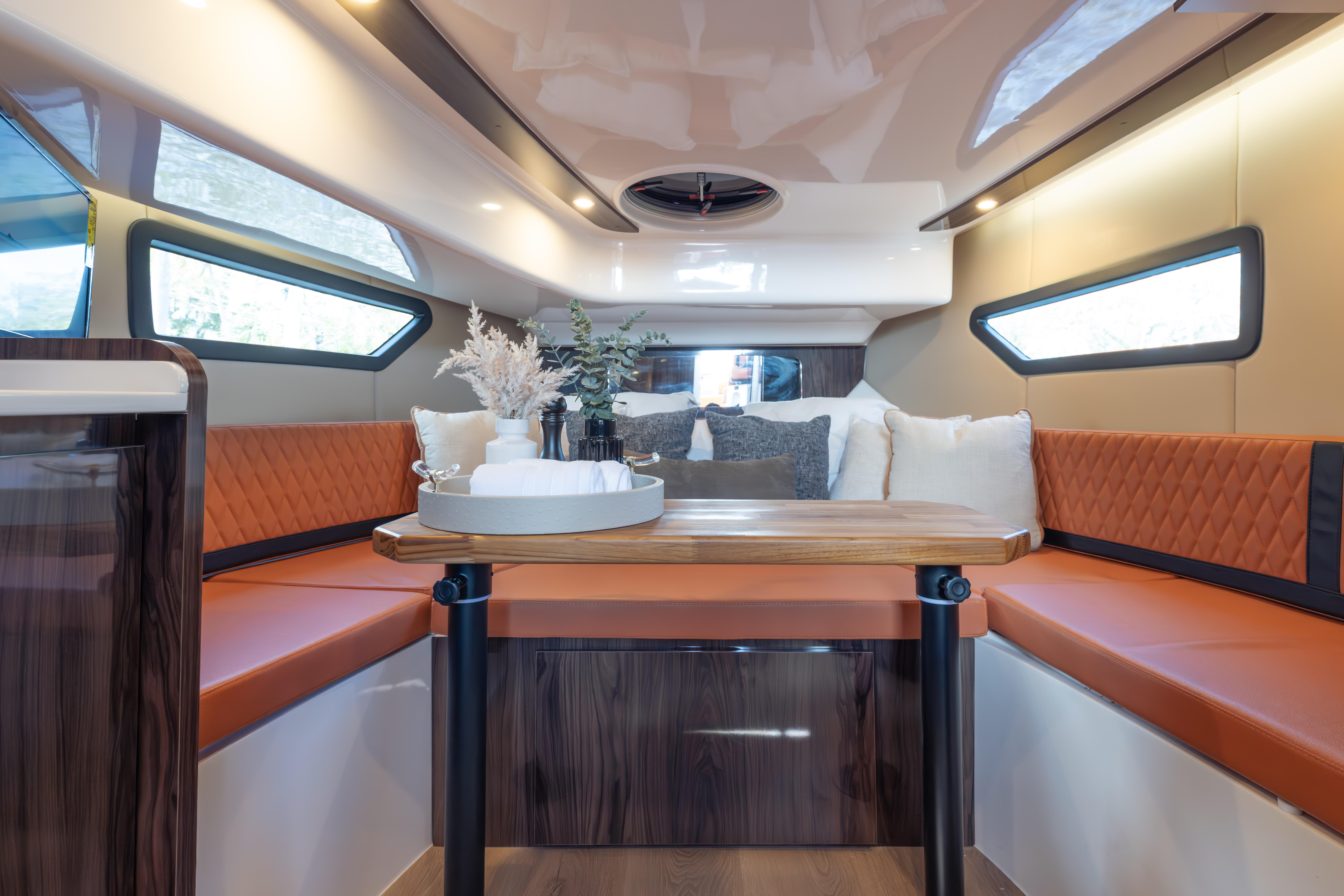 Luxurious interior of 2026 Hanover 387 yacht with elegant seating and modern decor.